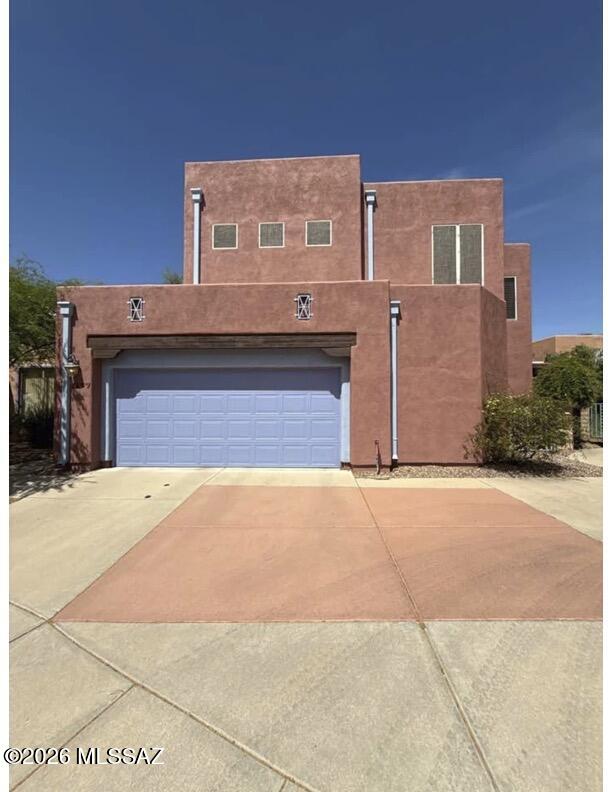 This spacious 1,812 square foot two-story home features 3 bedrooms and 2 bathrooms in the desirable Presidio at Williams Centre neighborhood. The well-appointed kitchen includes modern appliances such as a dishwasher, microwave, oven, and refrigerator, complemented by a convenient breakfast bar for casual dining. The open living areas showcase tile flooring throughout the main level, while comfortable carpet enhances the upper floor bedrooms, creating a warm and inviting atmosphere with plenty of natural light and ceiling fans for year-round comfort. The formal dining room provides an elegant space for entertaining, while the spacious living room serves as the heart of the home. The primary bedroom offers a peaceful retreat with an ensuite bathroom, while two additional bedrooms provide flexibility for family, guests, or a home office. The second full bathroom serves the remaining bedrooms and guests with convenient access. A dedicated laundry room houses the included washer and dryer, adding to the home's functionality. The attached 2-car garage provides secure parking and additional storage space. Outside, enjoy the privacy of a fenced yard perfect for relaxation and outdoor activities. Residents also have access to the community pool, ideal for cooling off during Tucson's warm months. The Presidio at Williams Centre location offers convenient access to shopping, dining, and major commuter routes throughout Tucson. Both dogs and cats are welcome, making this the perfect home for pet owners seeking comfort and convenience.