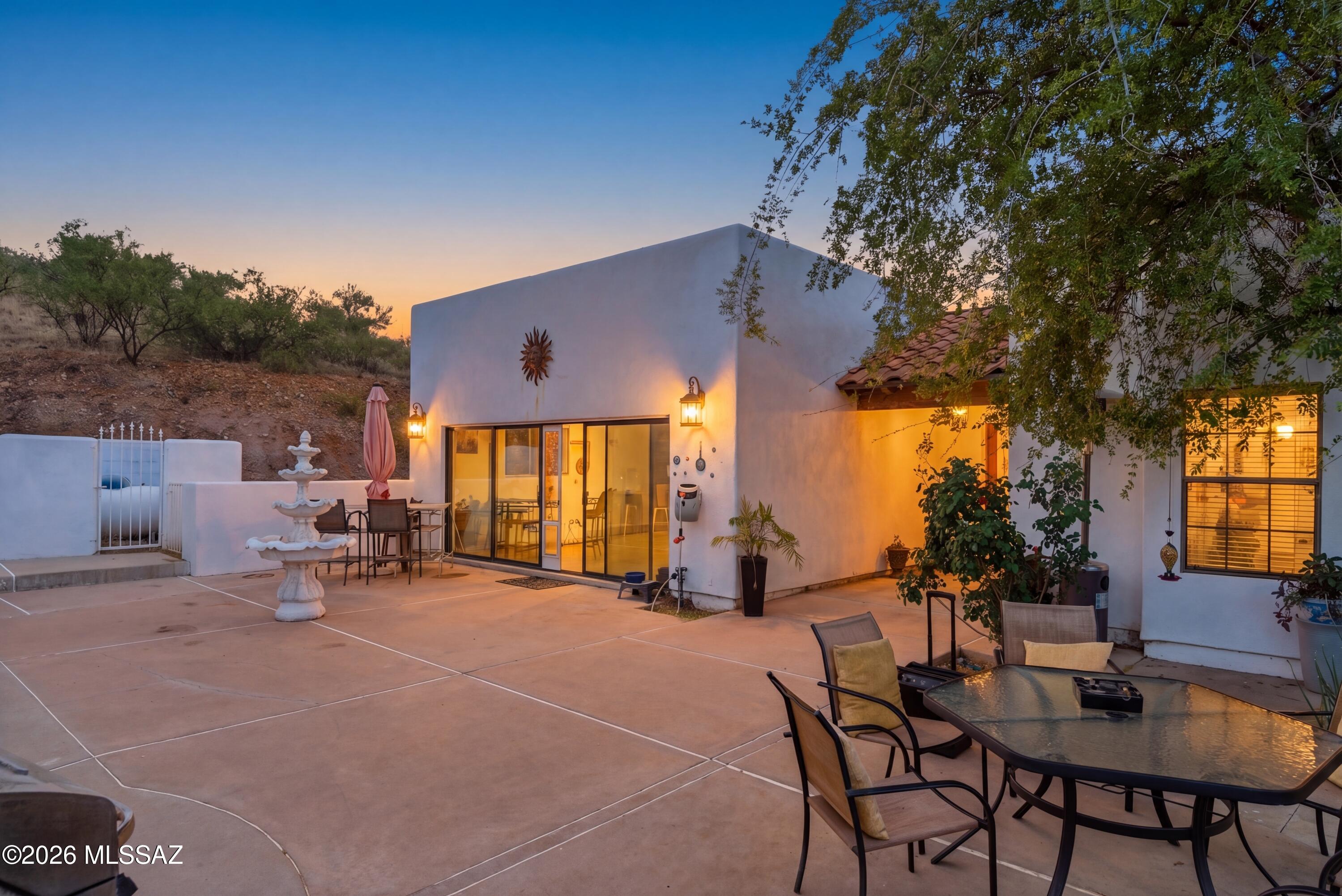 Vews like this don't come with a zip code, they come with a lifestyle.

Perched above Rio Rico on two combined parcels totaling 1.76 acres, 221 Paseo Tamex delivers a property that simply doesn't exist at this price point anywhere else in Southern Arizona. The panoramic views stretching toward Mexico through a commercial-sized picture window set the tone the moment you walk through; this is not a standard home. Inside, granite counters, tile and laminate floors throughout, newer stainless appliances, and three refrigerators make the home as functional as it is impressive. The dedicated game room and the flexible media room give this property a versatility that buyers rarely find; whether you're entertaining, working from home, or simply living your best life. The infrastructure here is extraordinary. A 28-panel solar system producing 10% more energy than the home consumes. A 13,000-watt propane generator for complete backup power. Septic system, water softener, and dedicated drinking water filtration. Roof recoated one year ago. The property basically runs itself.

For the automotive enthusiast or serious hobbyist; an 11,000 lb car lift under a 3-car carport, and an oversized depth 3-car garage with dedicated shop space rounds out a package that most buyers spend a lifetime looking for.

The property comes fully furnished per inventory list. The views are permanent. The opportunity is now.