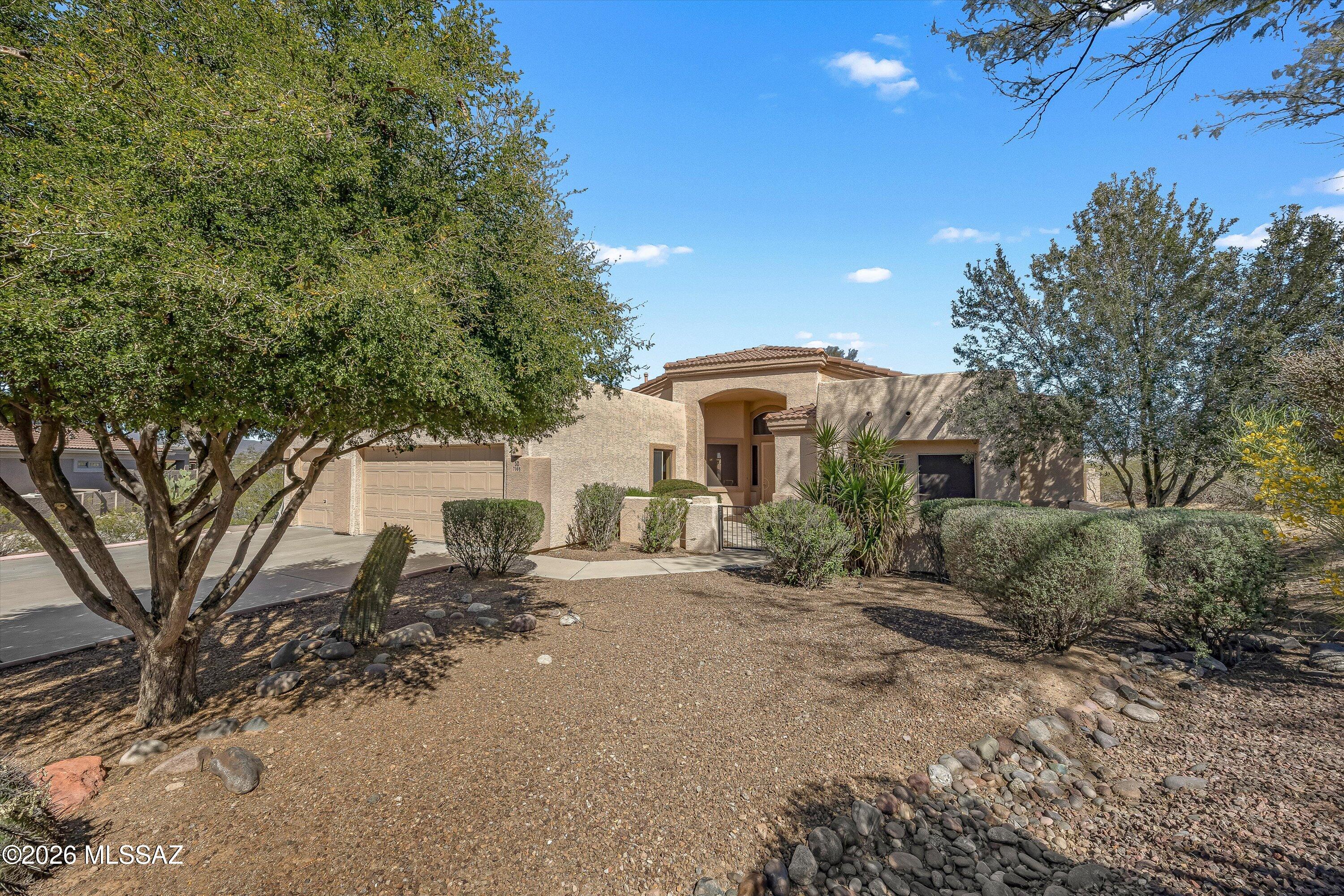 Located in one of the premier neighborhoods in Continental Ranch, this single-story home sits on a 1-acre cul-de-sac lot with views of the Tucson, Catalina, and Tortolita Mountains. The 2,054 sq ft floor plan features 4 bedrooms, 2 bathrooms, and a 3-car garage with built-in cabinets. The upgraded kitchen includes granite countertops, tile backsplash, gas cooktop, built-in oven, and all appliances included. Inside you'll find vaulted ceilings, tile in the main living areas, laminate flooring in the bedrooms, and a three-sided fireplace. The primary suite offers vaulted ceilings, patio access, double sinks, garden tub, separate shower, and walk-in closet. The backyard features a 40' x 18' extended patio, storage shed, and a  gate leading to your own desert sanctuary.