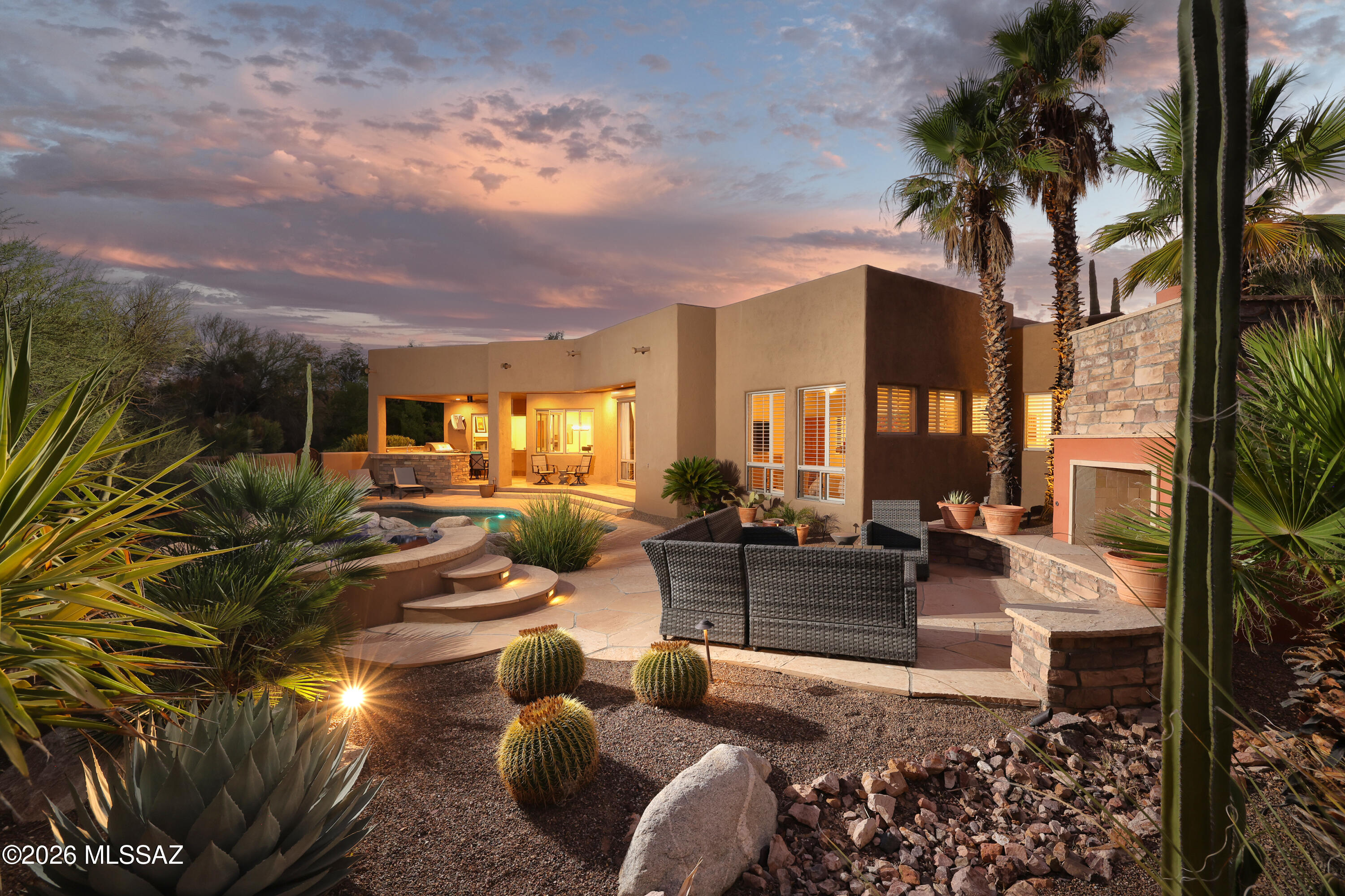 Just off a quiet cul-de-sac in desirable Alta Vista is this very private quality residence. An impeccable Southwest contemporary home high in the Catalina Foothills. Stunning true concrete floors throughout. Chefs open kitchen. Delightful split floorplan. Resort style, private back yard featuring an amazing outdoor kitchen, sparkling pool with waterfall from the elevated spa, custom fireplace and unobstructed mountain views. Bordering a lush common area for an ultimate resort setting. This better than new property has been fine tuned by the current owners to delight your sense for peace and tranquility!