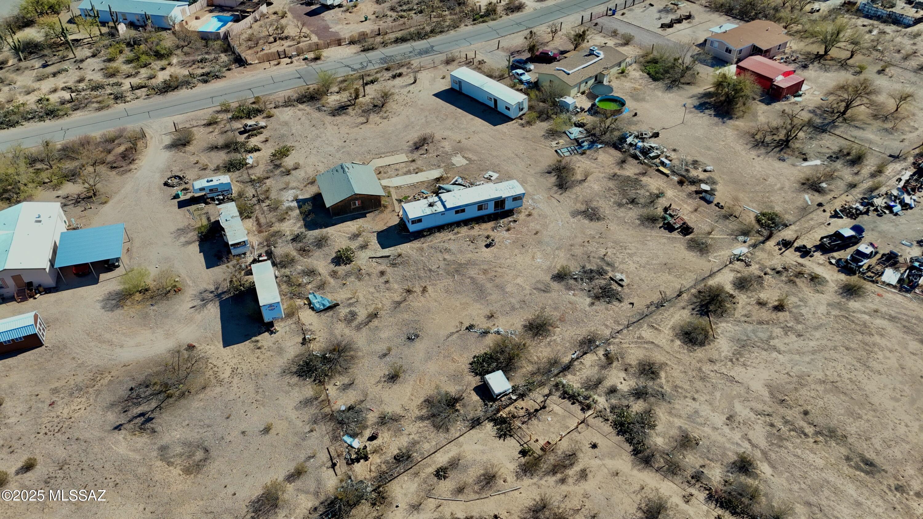 This 1.2-acre land lot for sale offers breathtaking mountain views and is fully fenced for privacy. The existing structures are in poor condition and should be considered for removal. Zoned for horses, this property provides the perfect opportunity to build your dream ranch home. This property features a two-car garage, offering potential for someone with a vision. It could be revitalized for use as additional storage or a workshop, or even potentially rebuilt to suit your needs. Its location and size present a solid foundation for future improvements or upgrades, adding long-term value to the property. With utility hookups already in place, you can start your project right away. Whether you're looking for a peaceful retreat or a functional ranch, this lot has the potential to become exactly what you envision. Don't miss out!