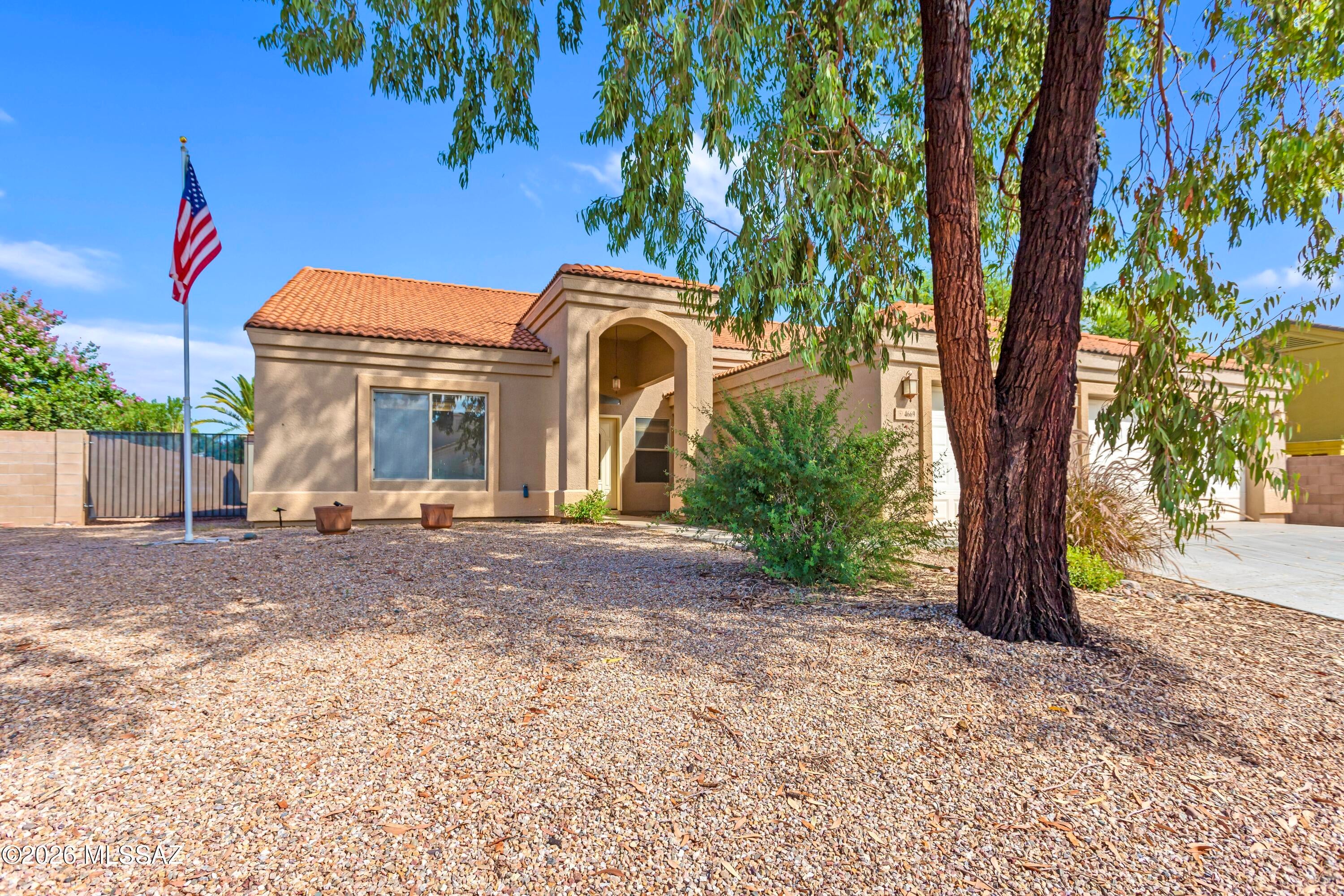 Welcome to this beautifully refreshed 2,300 sq ft home offering 4 bedrooms, 2 bathrooms, and a flexible floor plan designed for comfortable living and entertaining. Fresh interior paint creates a clean, inviting feel throughout, while the updated kitchen and vaulted ceiling add style and spaciousness. The 4th bedroom offers flexibility as an office, guest room, or additional living space. Enjoy both a living room and den, plus a spacious primary suite featuring a private bathroom with separate tub and shower. The backyard is made for Arizona living, featuring a sparkling pool surrounded by low-maintenance artificial turf, an open paver patio with fire pit, covered patio, and dedicated dog run. A 3-car garage provides plenty of room for vehicles, storage, and more. This one has it all!