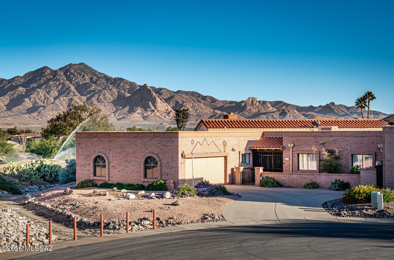 BREATHTAKING PANORAMIC VIEWS! This spacious 2-bedroom, 2-bath home with den sits on an extra-large lot overlooking the golf course, mountains, and a beautiful pond with fountain. Enjoy Arizona sunsets from the multiple covered patios or relax in the private backyard. The open living/dining area features a wet bar, while the generous kitchen offers a pantry and sunny eat-in nook. Split-bedroom layout provides privacy, with spacious rooms, a hobby/craft room, and convenient laundry room. An inviting entry courtyard, mature low-maintenance landscaping, and oversized side-load 2-car garage with utility sink and separate storage add to the appeal. Views, space, privacy, and effortless Arizona living!