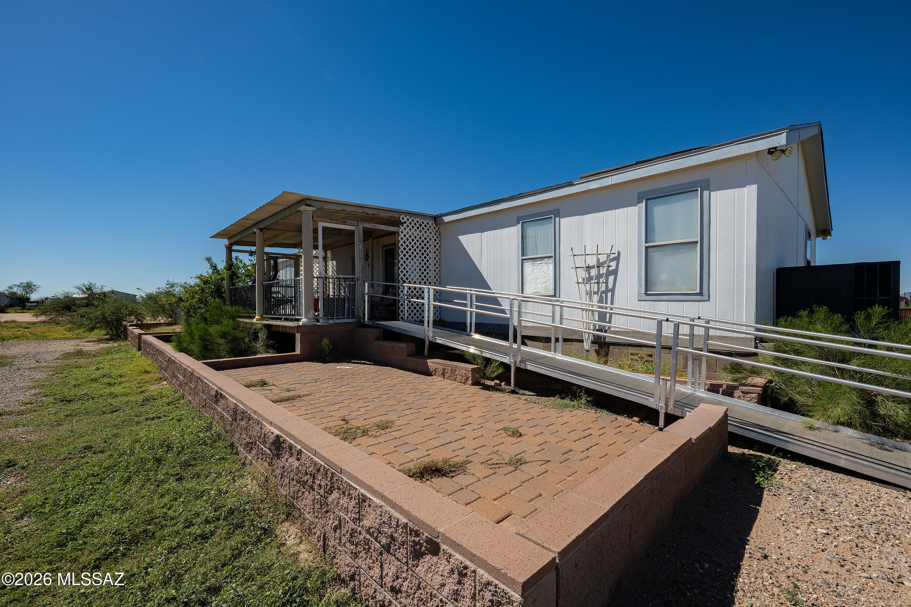 Incredible Opportunity to start your own mini-farm! Bring your animals, plant your crops! Be Self Sufficent! This 2006 Manufactured home has a great floor plan with many upgrades. Enter into the formal Living room that opens onto the huge kitchen with island and upgraded granite slab counter tops. You can cook
to your hearts content! Primary Suite is located on the north end of the home with an upgraded bathroom! There
are 3 additional bedrooms with an office plus a huge family room with fireplace on the south end of the home. Huge covered decks on the front and back of home with views for days and days. Plus a separate 2 car detached garage. The fully fenced property is ready for the new owner! some furnishing can stay. for the owner!