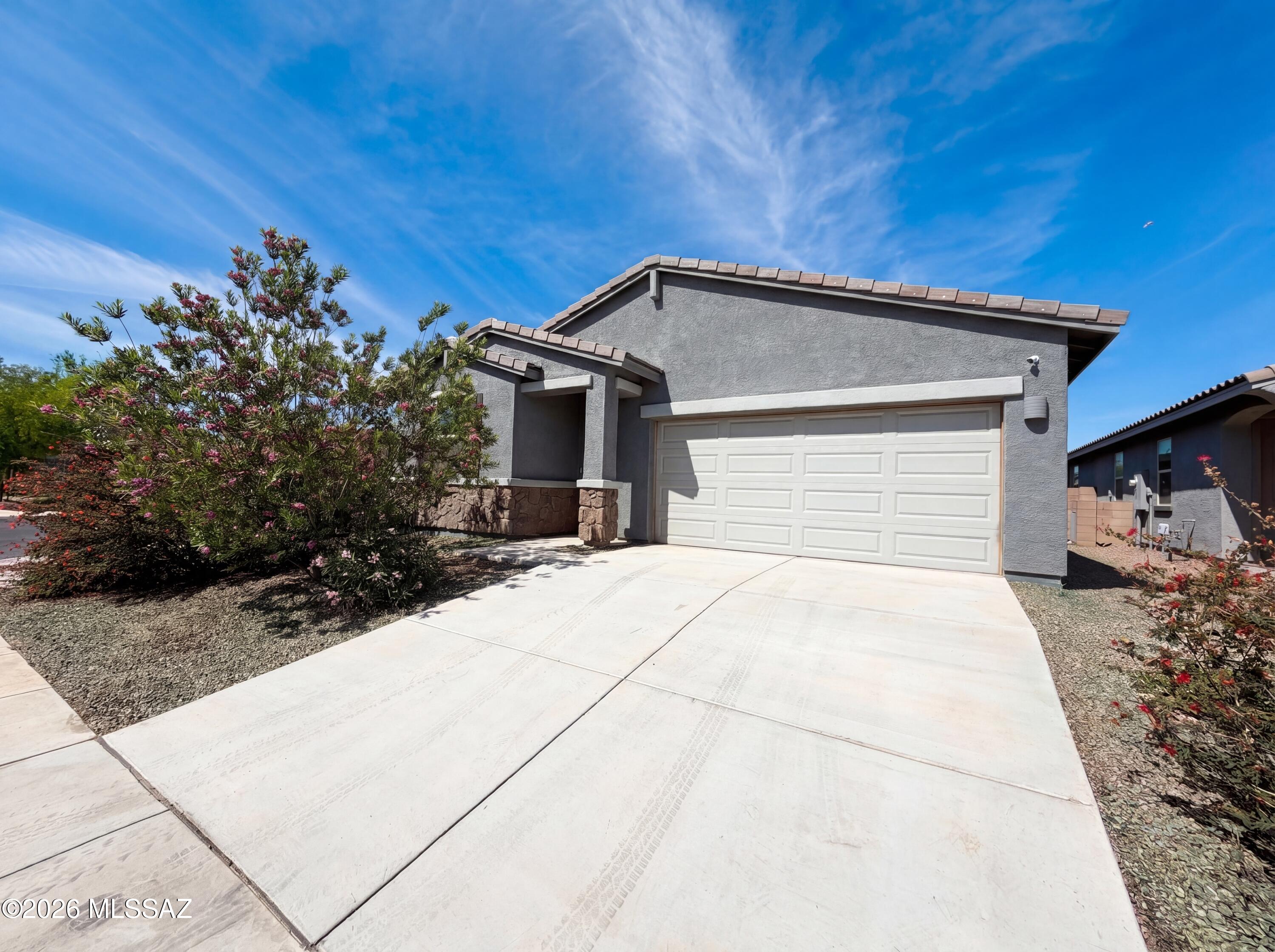 Come see 12701 N Gibbs Ave, a practical residence designed for comfortable daily living. The kitchen features a functional island and stainless steel appliances, while the primary bedroom includes a walk in closet, and its bathroom provides double sinks. A covered patio extends to a fully fenced in backyard. This home perfectly blends modern utility with comfort and outdoor enjoyment. Included 100-Day Home Warranty with buyer activation