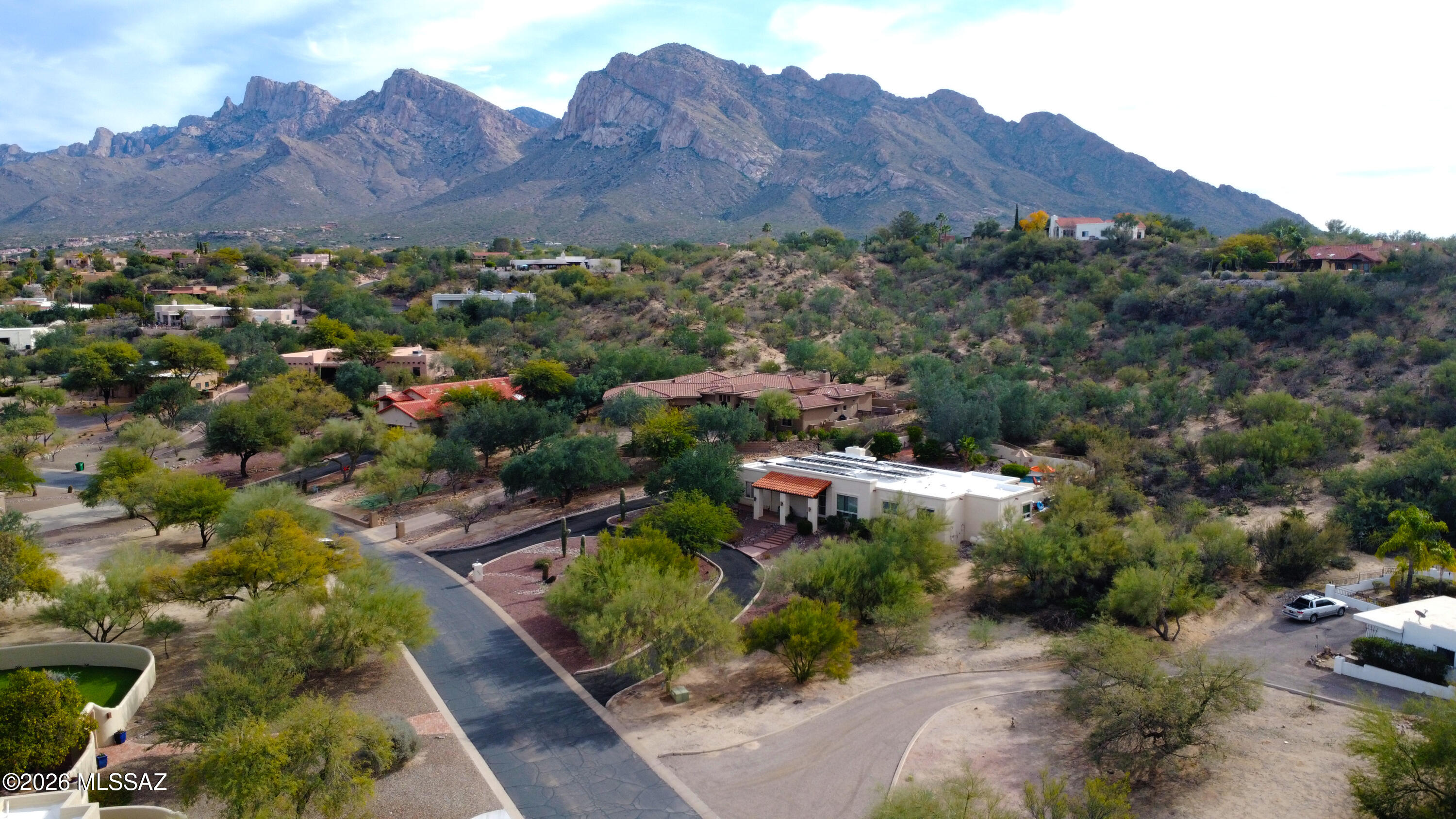 An exceedingly rare opportunity to own a luxury home on a large parcel in Oro Valley with no HOA, just 1,000ft from the Oro Valley Country Club Golf Course Parking Lot. This beautifully maintained property is nestled among million-dollar homes and offers a truly convenient location to Tucson+Oro Valley attractions and shopping. The immaculately landscaped backyard is a private oasis featuring a pool, hot tub, two mature citrus trees, and stunning views of Pusch Ridge -a perfect space for both relaxation and entertaining. Inside and out, the home showcases thoughtful custom upgrades that make it stand apart. Bonus: Both HVAC systems are new as of 2023. This is a special property in an area that rarely has houses available for sale. We recommend acting quick!