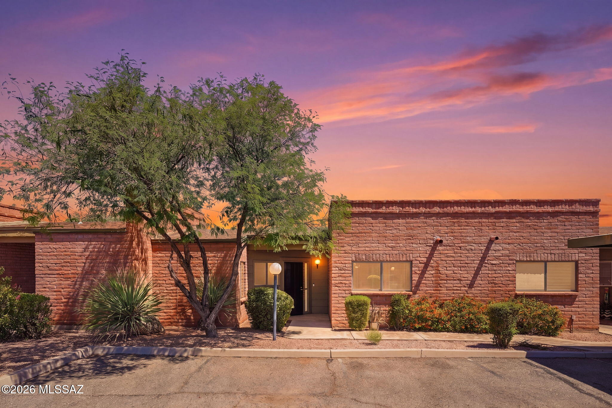 Amazing opportunity for affordable 1,117 SqFt 2 bed/2 full bath single story masonry townhome in the desirable McCormick Townhomes neighborhood in thriving Central Tucson. This is the move-in ready townhome you have been searching for, single story, no stairs, no steps, N/S orientation, concrete sidewalks, ample guest parking and one assigned covered parking space.  $215 monthly HOA includes refreshing community pool, heated spa, water, sewer, garbage collection, recreation room, common area & street maintenance.
The landscaped front yard has low care native desert vegetation, concrete sidewalk and wrought iron security gate. Inside buyers will appreciate the spacious living room with wood burning fireplace, slider to covered patio providing daily Catalina mountain views, luxury plank, carpet and tile flooring, skylights, laundry room with washer and dryer included, Ring doorbell security camera, illuminated ceiling fans, cozy kitchen with tall vaulted ceiling, modern maple shaker kitchen cabinets, ample countertop space, stainless steel refrigerator, dishwasher, electric oven, double metal sink w/garbage disposal, garden window and breakfast nook. Large full guest bathroom with updated quartz modern vanity and tiled shower/tub. Spacious primary retreat offers large walk-in closet, luxury plank flooring, sliding door access to covered back patio and updated ensuite full bathroom with quartz modern vanity and walk-in tiled glass shower.
Enjoy tranquil Tucson nights from low maintenance covered back concrete patio with picturesque Catalina mountain omnipresent views, storage closet, storage shed, surrounded by tall privacy block walls with side gate access. 
Fantastic Central Tucson location walking distance to 14.2 acre McCormick Park (an expansive neighborhood park featuring large green grassy fields, a basketball court, a playground, and baseball fields), Chuck Huckelberry Loop/ Rillito River Path (136 mile multi-use connected paved path used for walking, running, biking and skating), close proximity to groceries, restaurants, shopping, Tucson Medical Center, minutes away from the JCC, Banner Medical and the University of Arizona campus! Call to make your appointment to view this move-in ready townhome today!