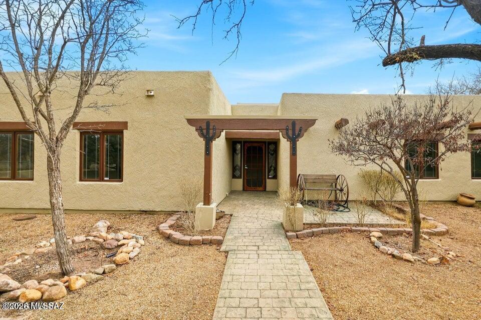 An exceptionally rare opportunity to own 20 private acres along the Bobocomari River, offering space, versatility, and a peaceful connection to nature. Surrounded by beautiful views and quiet desert landscape, this property invites you to slow down and enjoy wide-open skies, abundant wildlife, and the serenity of rural living. The 2,259 sq ft custom home, built in 1986, features 3 bedrooms and 2 bathrooms with warm Saltillo tile flooring, a wood-burning fireplace equipped with a blower and integrated ductwork for efficient heating, and a kitchen complete with stainless steel appliances. The home opens to inviting patios and courtyards designed for relaxing and taking in the natural surroundings. Outdoor amenities make this property truly special, including a custom steel-roof gazebo perfect for enjoying birds, wildlife, and Arizona's stunning sunsets. The property also includes two spacious outbuildings offering exceptional flexibility. One shop measures approximately 40'x20', while the second 50'x30' building features a dedicated black room and print shop area equipped with mini-split systems, ideal for creative work, hobbies, storage, or business use. A large 40'x30' greenhouse provides excellent space for gardening, growing, or homesteading pursuits.
With fenced areas surrounding home and along the front and side property boundaries, this versatile parcel is ideal for those seeking a homestead, retreat, workspace, or simply room to breathe. Properties offering this level of privacy, usable acreage, and natural beauty are increasingly hard to find.