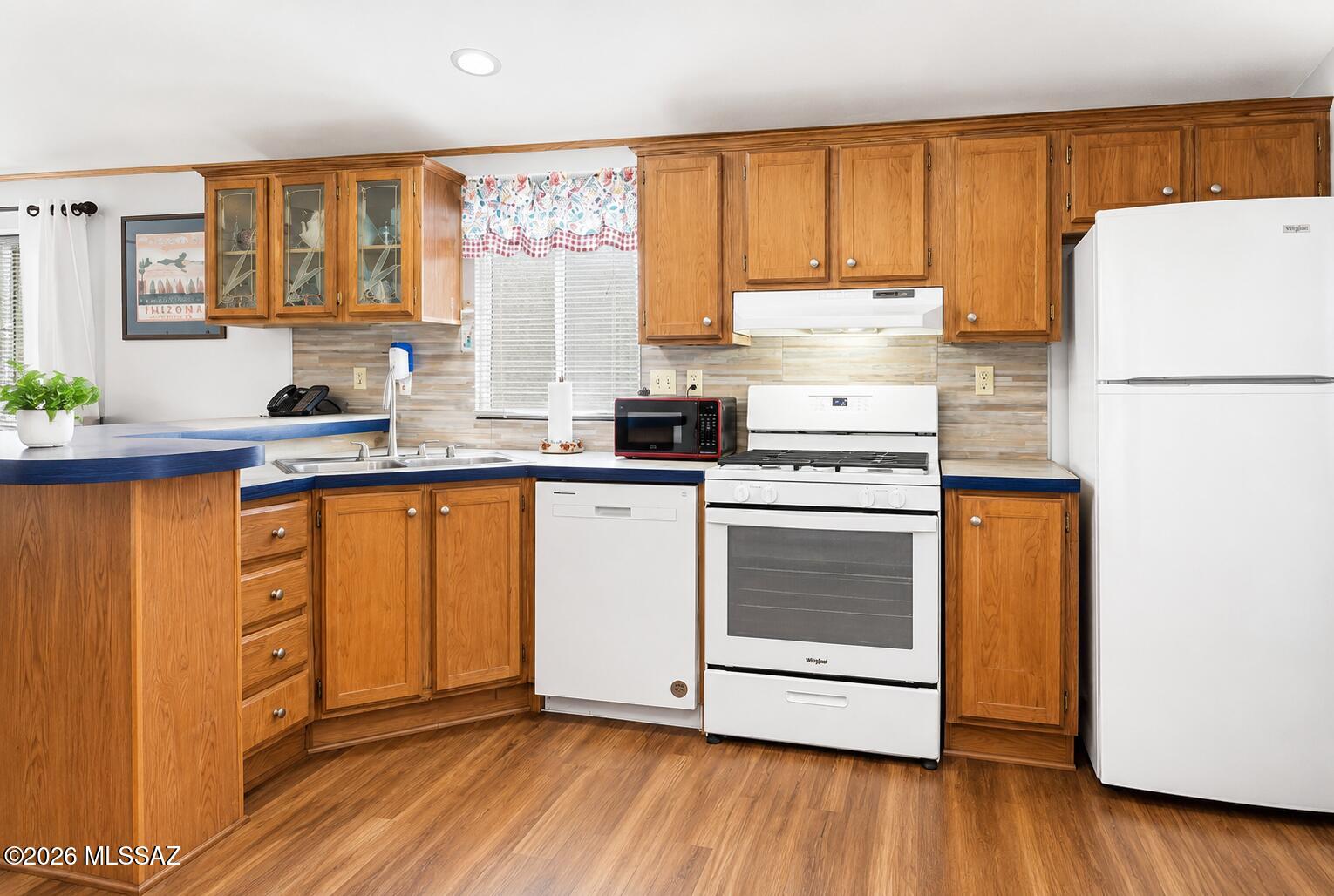 Located on leased land in the desirable Tucson Meadows 55+ community, this beautifully maintained 1999 manufactured home offers 2 bedrooms, 2 bathrooms, a split floor plan, and a BRAND-NEW A/C for year-round comfort. Relax on the private balcony with mountain views, enjoy the convenience of a spacious laundry room, a shaded 3-car carport, and a fenced dog run. Tucson Meadows offers an exceptional active-adult lifestyle with a heated pool and spa, clubhouse, fitness center, saunas, game room, picnic areas, private walking and biking streets, RV storage, and access to Rolling Hills Golf Course amenities. A wonderful opportunity to enjoy comfort, community, and convenience! Welcome to your Tucson Home!