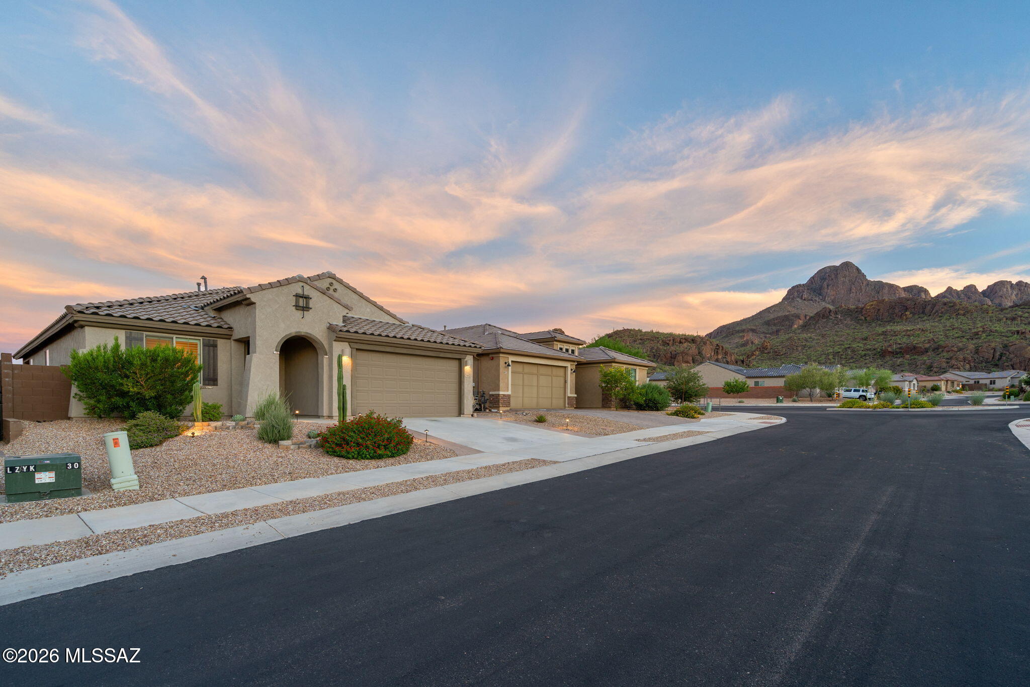 Range priced $500,000-$540,000. Experience stunning mountain views from this beautifully maintained 2022 home in the gated community of Lazy K Bar Ranch at the base of Sombrero Peak. This single-story home features 4 bedrooms, 2 bathrooms, plus a versatile den ideal for a home office or playroom. The bright, open floor plan offers modern finishes, plantation shutters, and remote-controlled blinds in the living room. Enjoy an extended covered patio, low-maintenance backyard with fire pit, pavers and turf, and breathtaking desert views. Located on a quiet cul-de-sac with no homes directly across the street, you'll also enjoy neighborhood hiking trails, a park, playground, and easy access to shopping, dining, and everyday conveniences.