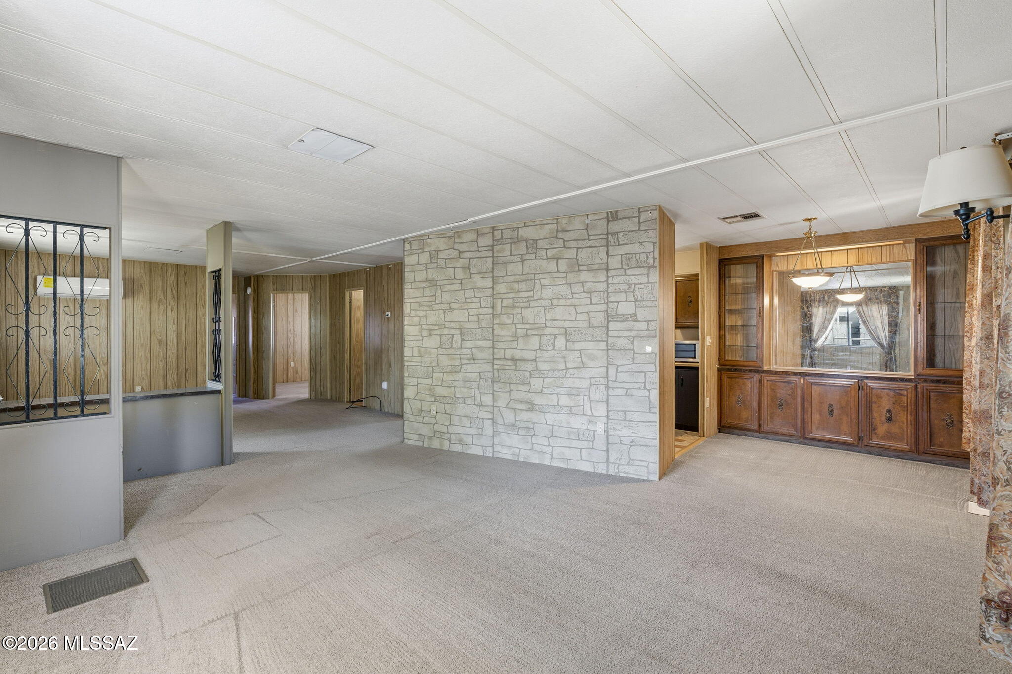 Great opportunity to own a lake view home in desirable Swan Lake Estates. Enjoy peaceful water views and the ability to fish right around the corner. This home offers solid potential and is ready for your personal updates and cosmetic refresh.

Gated community amenities include pickleball, horseshoes, bocce ball, shuffleboard, spa, two pools, billiards, library, two clubhouses, and an exercise room. Lot rent covers water, sewer, and trash.

Convenient central Tucson location near restaurants, shopping, medical services, Tucson Mall, and the Auto Mall. Ideal for snowbirds or anyone seeking an active, low-maintenance lifestyle with beautiful lake views.