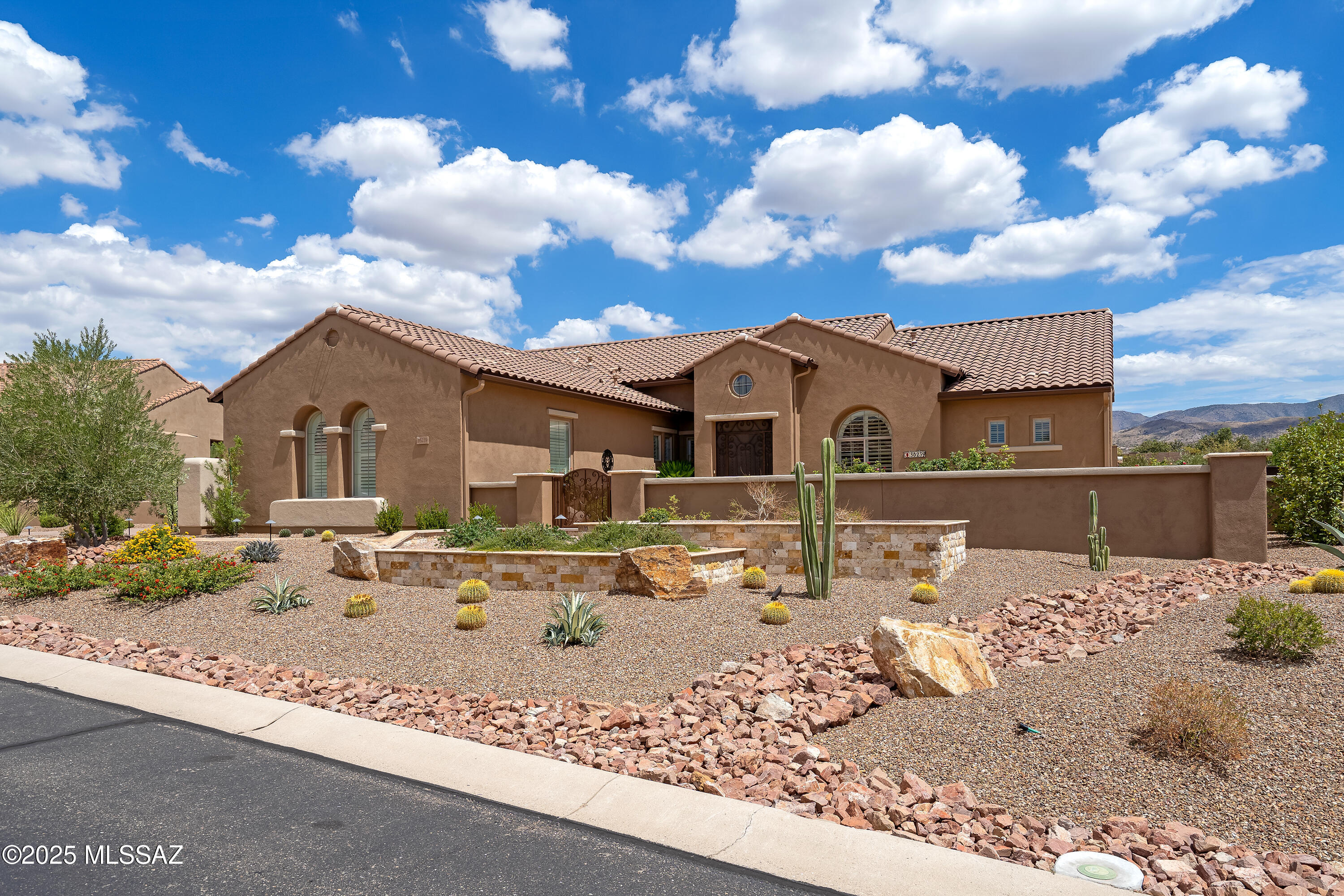 Stunning Catalina Model in The Preserve - An Oasis in the Desert. This beautifully upgraded and priced to sell home offers refined living and an impressive list of updates completed since 2022. The gourmet kitchen features double ovens, a new gas cooktop, new sink & faucet, new garbage disposal, and a new dishwasher. The kitchen also boasts a walk-in pantry, and a butler's pantry with bar sink. The upgraded laundry room showcases quartz counters and decorative tile. 
Major system updates include a brand-new HVAC system installed in 2023; a new water heater also installed in 2023, a mini-split HVAC system in the golf-cart garage, and new double garage door with openers. 
The split-bedroom floor plan offers two private suites and multiple living areas for endless options. ; a formal Dining room and a spacious Great Room perfect for entertaining. The home is enhanced by shutters throughout.
Step outside to your private backyard oasis with two enclosed Arizona rooms (off the family room and primary suite), a newly built ramada-covered paver patio, lush grass area for pets, fruit trees, grapevines, roses, and an upgraded 8-zone irrigation system. The front yard is equally inviting with new planters and a travertine courtyard patio. 
This home blends comfort, elegance, and functionality ready for you to enjoy!