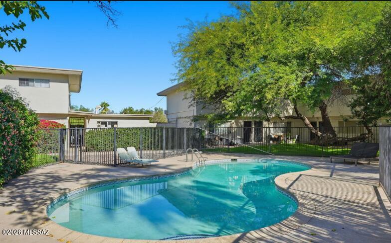 rime West University location! Amherst Club Condominiums is perfectly placed at University Blvd & 7th Ave--just blocks from the University of Arizona, 4th Avenue, & Tucson's vibrant Downtown. This well-kept 2-story corner unit features tons of natural light plus updates: freshly painted, new dishwasher (2025), carpet, water heater, light fixtures, and ceiling fans (Aug 2021). Gated entry opens to a grassy courtyard and sparkling community pool. HOA covers water, sewer, pool, common areas, exterior maintenance, and roof. A fantastic home or investment opportunity--come see it today
