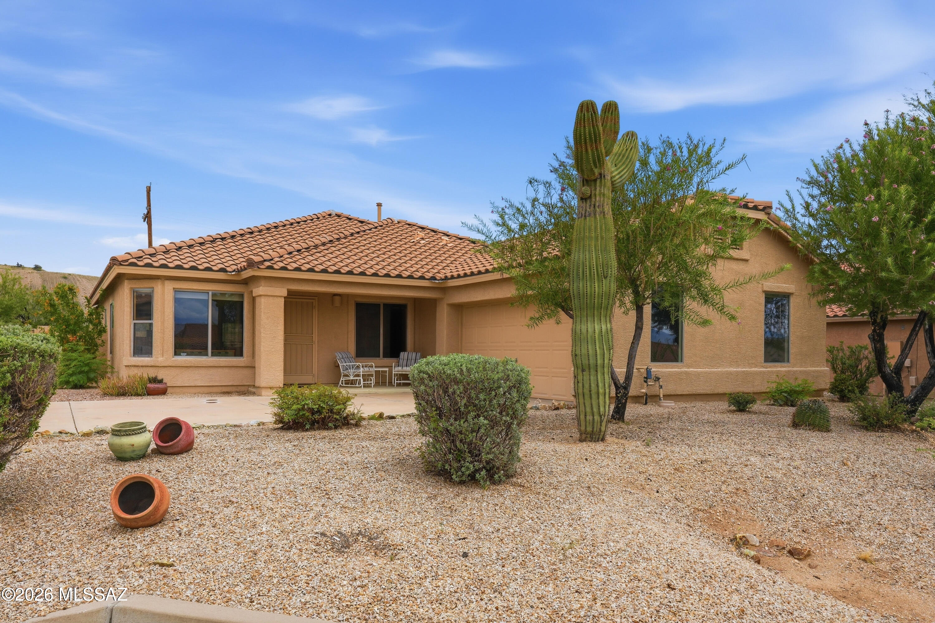 Mountain view vistas set on an oversized corner lot with no rear neighbors; this home offers the kind of privacy and openness that's hard to find. From the moment you walk in, abundant natural light fills the space, creating a warm, welcoming atmosphere from room to room. The thoughtfully designed open floor plan features two distinct living areas plus a versatile den, giving you the flexibility to create the lifestyle you want. Imagine a formal living room for entertaining guests, a cozy family room for movie nights, and a den that flexes as a home office, reading nook, or quiet retreat. Need extra dining space? The layout adapts easily, offering options for both casual meals and more intimate gatherings -- all while maintaining separate, private zones when you need them. Step outside and the possibilities keep going. The expansive backyard is a blank canvas for outdoor living -- envision a garden retreat for your favorite plants, or an open lawn for your pets to run and play, with plenty of room to add a pool where friends and family can lounge in luxury, it's your own private escape. Inside, the kitchen shines with brand-new stainless-steel appliances that make cooking and hosting a pleasure. Practical updates matter too -- this home features a new double underlayment roof, no carpet, and a brand-new hot water heater, offering peace of mind for years to come. With three comfortable bedrooms, there's plenty of room for guests, hobbies, or visiting family, while the primary suite offers a private escape at the end of the day. Enjoy the ease of single-level living surrounded by mountain scenery, in a vibrant 55+ neighborhood designed for relaxation and community. This is more than a house -- it's a place to settle in and truly enjoy life's next stage.