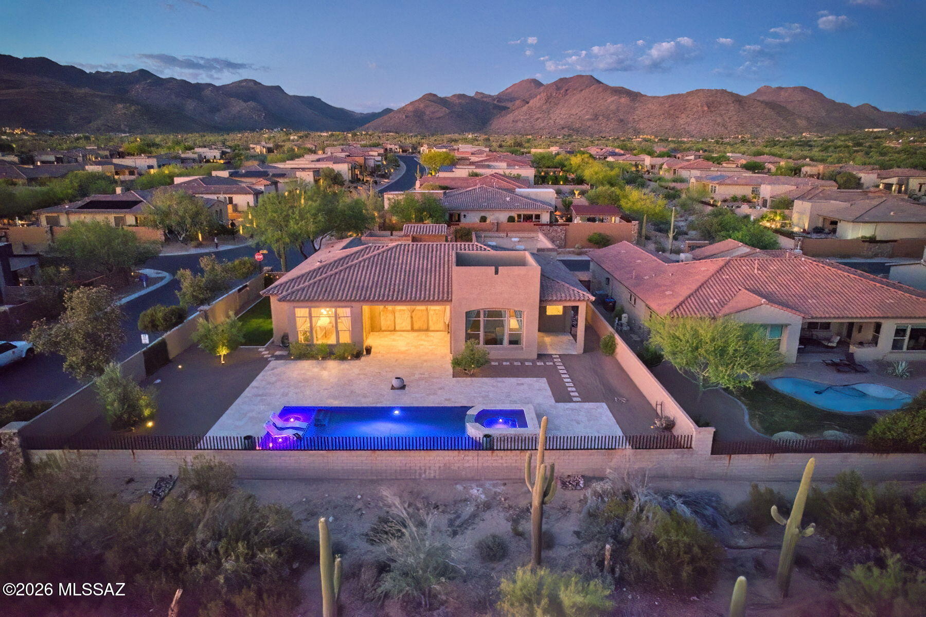 Discover one of the nicest homes available in Los Saguaros, showcasing Toll Brothers' finest craftsmanship. Perfectly positioned to take advantage of the stellar Southern Arizona Sunsets. This residence captures sweeping views of pristine natural desert, majestic mountains, and unforgettable AZ sunsets. The resort-style backyard is an entertainer's dream--beautifully designed with a  heated pool expansive travertine paver patio that invite year-round outdoor living. The great room is anchored by a stunning stone fireplace and media wall. travertine stone entry to wonderful courtyard. The home features an RO system, water softener and hi tech lighting.  Enter the dramatic courtyard complete with travertine pavers and stone walls. This home is a winning combination of elegance and comfort.