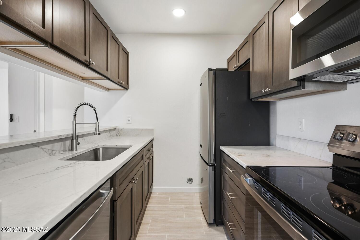 Stunning Fully Renovated Ground-Level Condo - Move-In Ready Perfection!
Discover modern luxury in this 2-bedroom, 2-bathroom condo, where every detail has been thoughtfully updated from floor to ceiling. Step inside to a fresh, contemporary interior featuring brand-new tile flooring, fresh interior paint, and abundant natural light. The gourmet kitchen, boasting new quartz countertops, new soft-close cabinets/drawers, and a full suite of stainless steel appliances (including refrigerator, range, dishwasher, and microwave). Cooking and entertaining have never been easier! Additional highlights include: New HVAC system, new water heater, new lighting fixtures and ceiling fans in every room. New plumbing fixtures and bathroom vanities. Don't miss this turnkey gem, everything has been done!