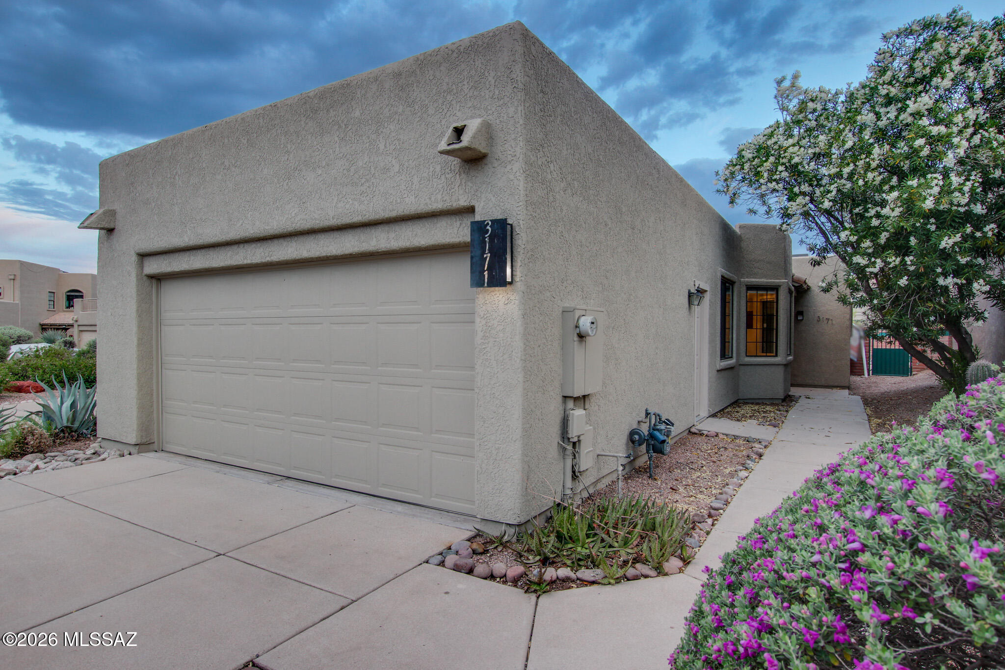 Beautifully maintained desert home with fresh exterior paint, newer HVAC, newer water heater and new dishwasher. Located within the desirable Starr Pass Golf Community in the Tucson Mountains. This charming single-story home offers 2 bedrooms, 2 bathrooms & a bright, open floor plan designed for comfortable living. The inviting living & dining areas flow seamlessly into the kitchen with ample cabinetry & workspace. The spacious primary suite features an en-suite bath & generous closet space, while the secondary bed & full bath provide flexibility for guests or a home office. Enjoy a private backyard with low-maintenance landscaping. Home offers a 2-car garage & well-sized lot. Ideally located minutes from Downtown Tucson, The University of Arizona & I-10, offering easy access to shopping, dining, golf & outdoor recreation.