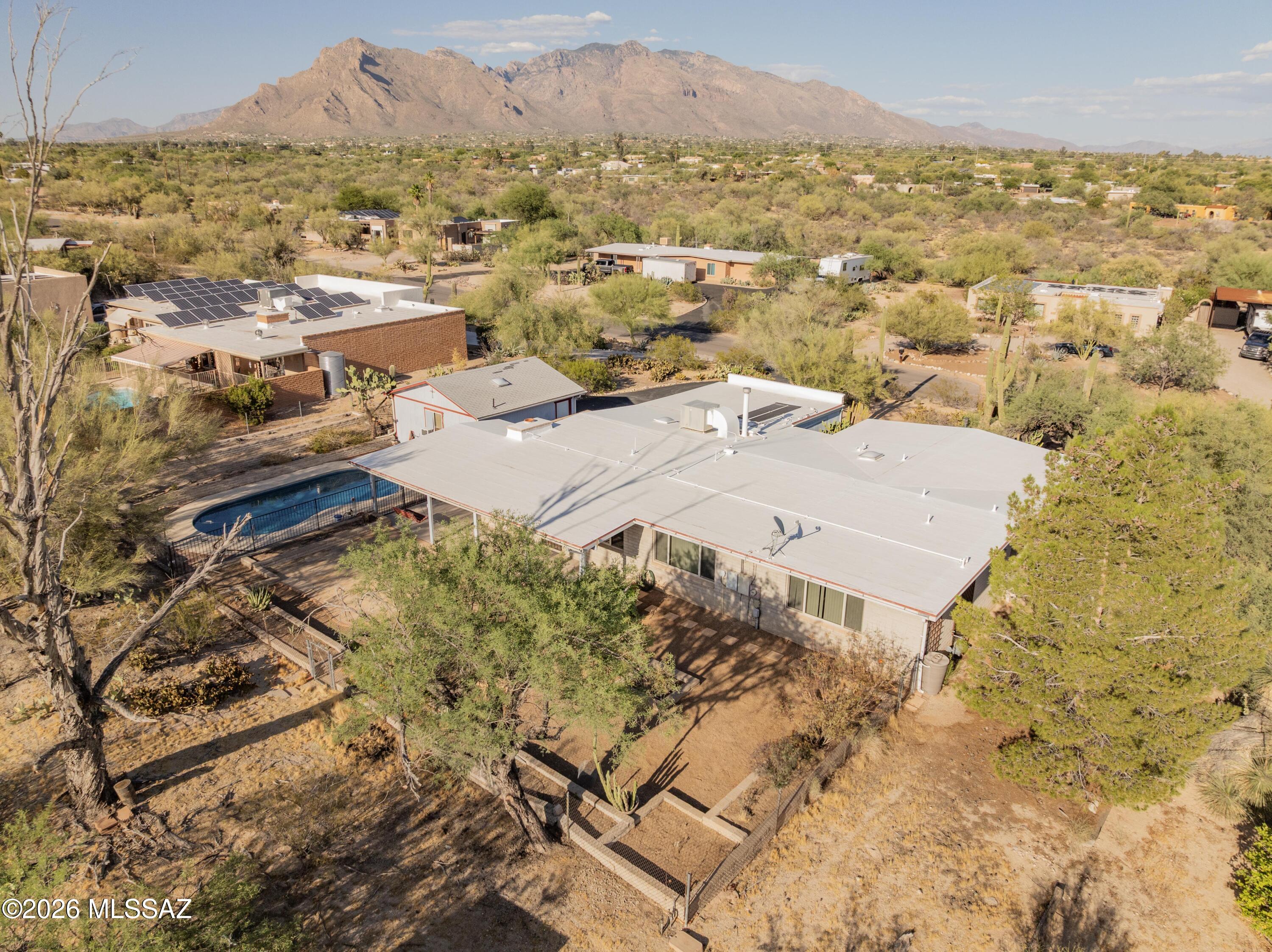 Fantastic 4-bed, 2-bath home situated on a .58-acre lot with beautiful mountain views and no HOA. With approximately 2170 square feet, there's plenty of room to spread out both inside and out.
 The kitchen has been updated with granite countertops, newer cabinets, new dishwasher and range, while fresh interior paint gives the home a clean, move-in ready feel. The spacious backyard offers a sparkling pool, room for entertaining, and endless possibilities for gardening, play areas, or storing your toys.
 A standout feature is the detached air-conditioned garage/workshop, perfect for projects, hobbies, extra storage, or a home business. The HVAC system was replaced in 2024, providing added peace of mind. 
Close to schools shopping and much more! 
You won't want to miss this opportunity.