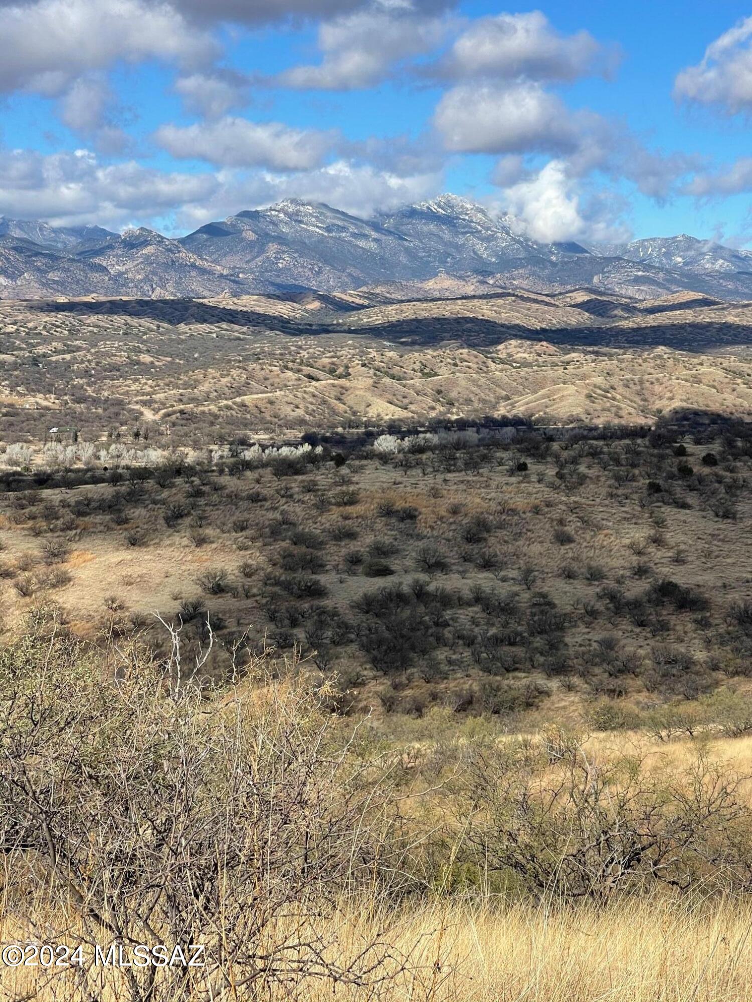 Solar Credit being offered by seller. Large 22 ac Parcel tucked up on Butte East of Town but still close . This hilltop has 360 deg views, you decide best views for your house with the Panoramic Mountain Views or Valley Town views. Semi remote yet still close to Patagonia businesses.