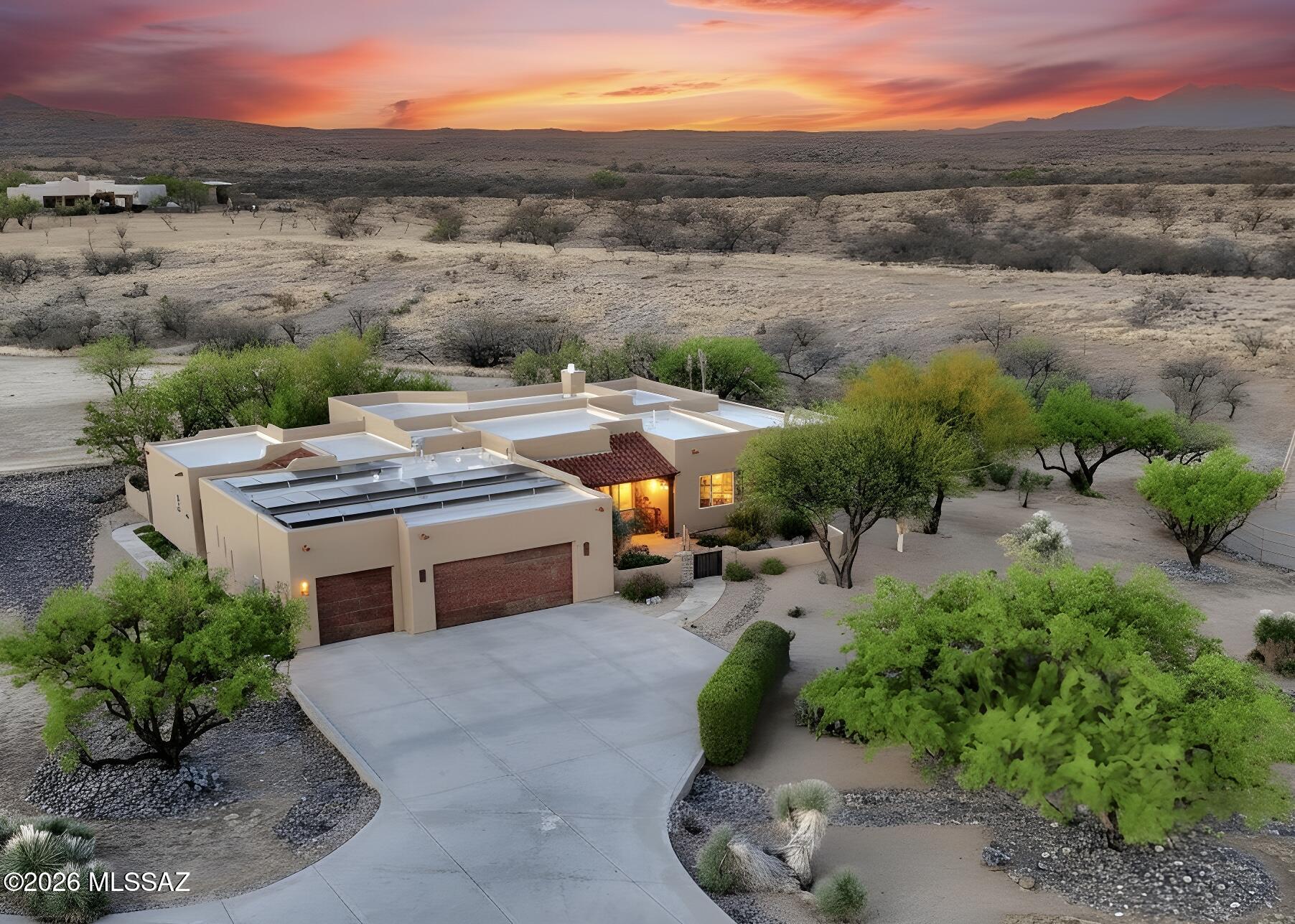 Back on the market at no fault of the home or the sellers!

Your Dream Home in Red Hawk at JSix Ranch Awaits! Nestled at the end of a quiet cul-de-sac, this custom-built Southwest Contemporary retreat offers elegance, comfort, and exceptional space for both everyday living and entertaining.
Inside, you'll find 3 bedrooms, 3 1/4 bathrooms, plus a private guest casita (1 bed/1 bath)--perfect for visiting family or friends. High-end finishes shine throughout, including travertine flooring, granite countertops, alder cabinetry, and premium KitchenAid stainless steel appliances.
The oversized primary suite is a true retreat, featuring a cozy sitting area, direct patio access, a spacious walk-in closet, and a spa-like bath complete with a luxurious walk-in shower and deep jetted tub. Expansive rear-facing windows fill the home with natural light while framing serene desert views.
Practical features include a three-car oversized garage--large enough for a full-size truck--and owned solar panels that significantly reduce energy costs.
Step outside to enjoy covered patios in both the front and back, ideal for soaking in stunning sunrises, sunsets, and the daily visits from local wildlife.
For equestrian enthusiasts, the property is fully equipped with a thoughtfully designed barn featuring two stalls with automatic waterers, a wash rack, storage space, and a temperature-controlled tack room with hot water. Additional amenities include paddocks, a round pen, a large turnout area, and a pipe-fenced arena--everything needed for your horses.
Both the interior and exterior have been freshly painted within the past two years, making this home truly move-in ready.