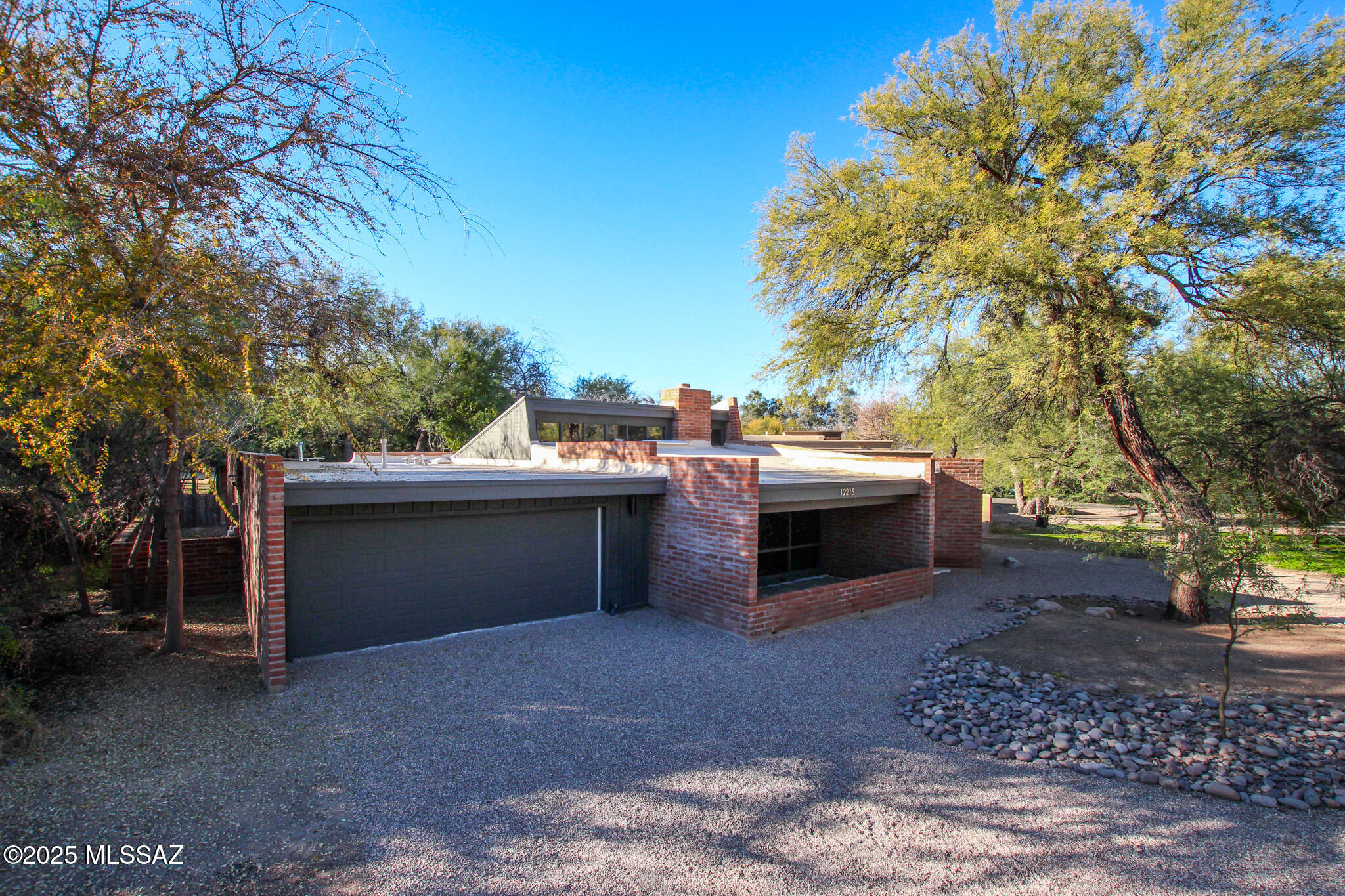 Don't miss this rare opportunity to own an architecturally significant home in desirable
Forty-Niners Country Club Estates. Designed by renowned architect David Tyson, this
home features all his signature elements including dramatic woodbeam ceilings &
trim, dramatic sightlines, & abundant entertaining areas. It also features extensive
exposed adobe walls- a delightful and seldom-found feature in a Tyson home.
With a super functional floor plan, this 4 bedroom, 3 bathroom home was recently
completely renovated with the help of a designer keen on preserving the character of
unique properties & boasts all the modern conveniences we desire- without stripping
away the charm. Everything is new including new dual pane windows- which were added preserving the signature Tyson wood trim, 24x48 ceramic tile flooring, plush bedroom carpet, TWO new AC units, and a brand-new roof. The stunning semi-custom kitchen features quality quartz countertops, sleek cabinetry, stainless steel appliances, and modern fixtures. Bathrooms showcase stylish tile shower surrounds and updated hardware. Fresh interior and exterior paint creates a bright, refreshed feel throughout. Enjoy resort-style outdoor living with a replastered pool, new pool equipment, pump, and heater. Truly move-in ready with premium upgrades inside and out. Nestled in the serene mesquite bosques of classic Forty-Niners Country Club, this gem won't last long!