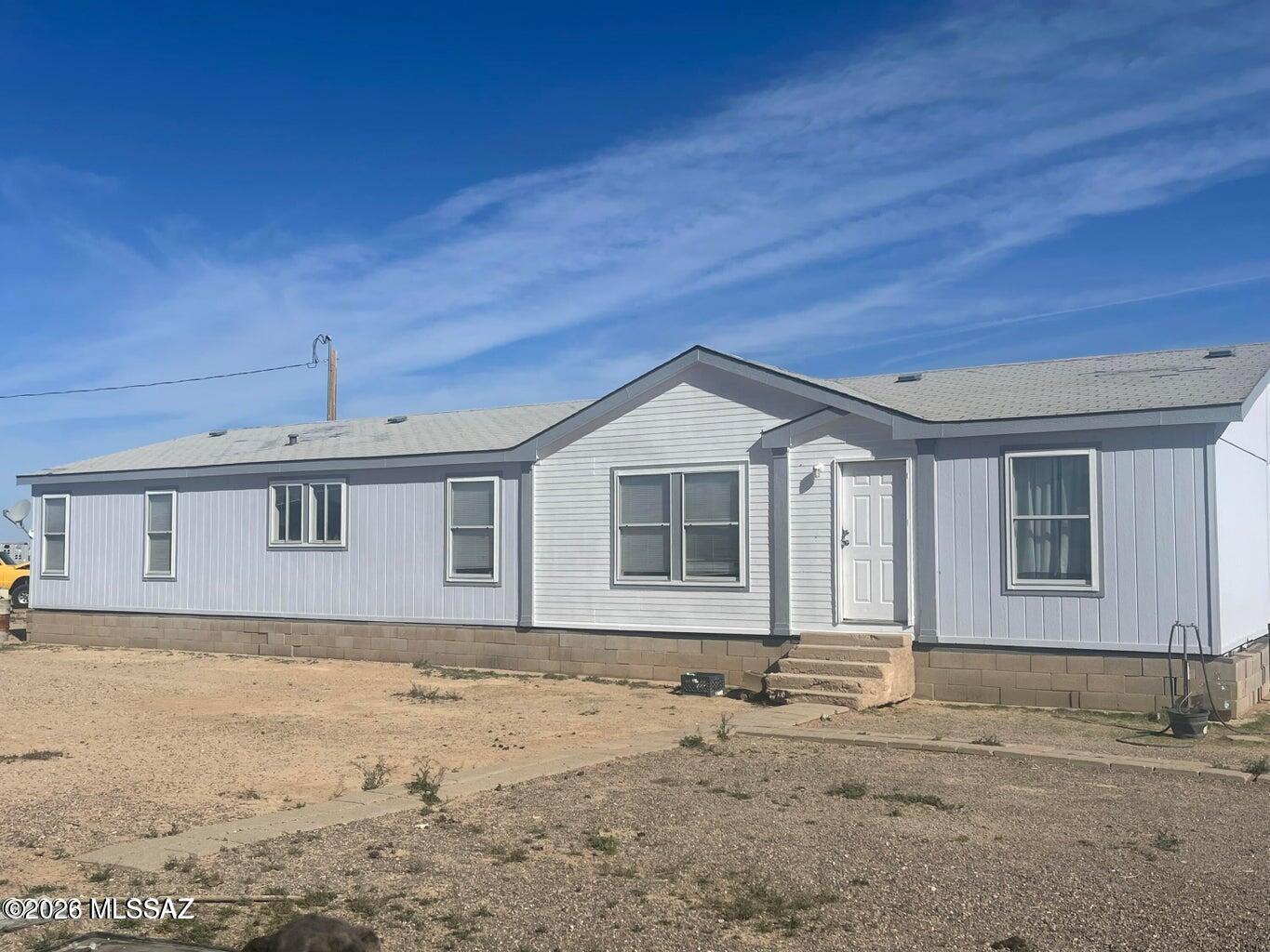 Large home on 70 fenced acres. This includes parcel 303-05-014A also. Pipe Metal fencing on the entire perimeter.  There are 23 large separate pens that have water to them. Would be a great set up for livestock. Property has city water and also a well. The well has not worked in several years due to a broken pipe. Sellers say to bring all offers as this is a sale per their divorce.
