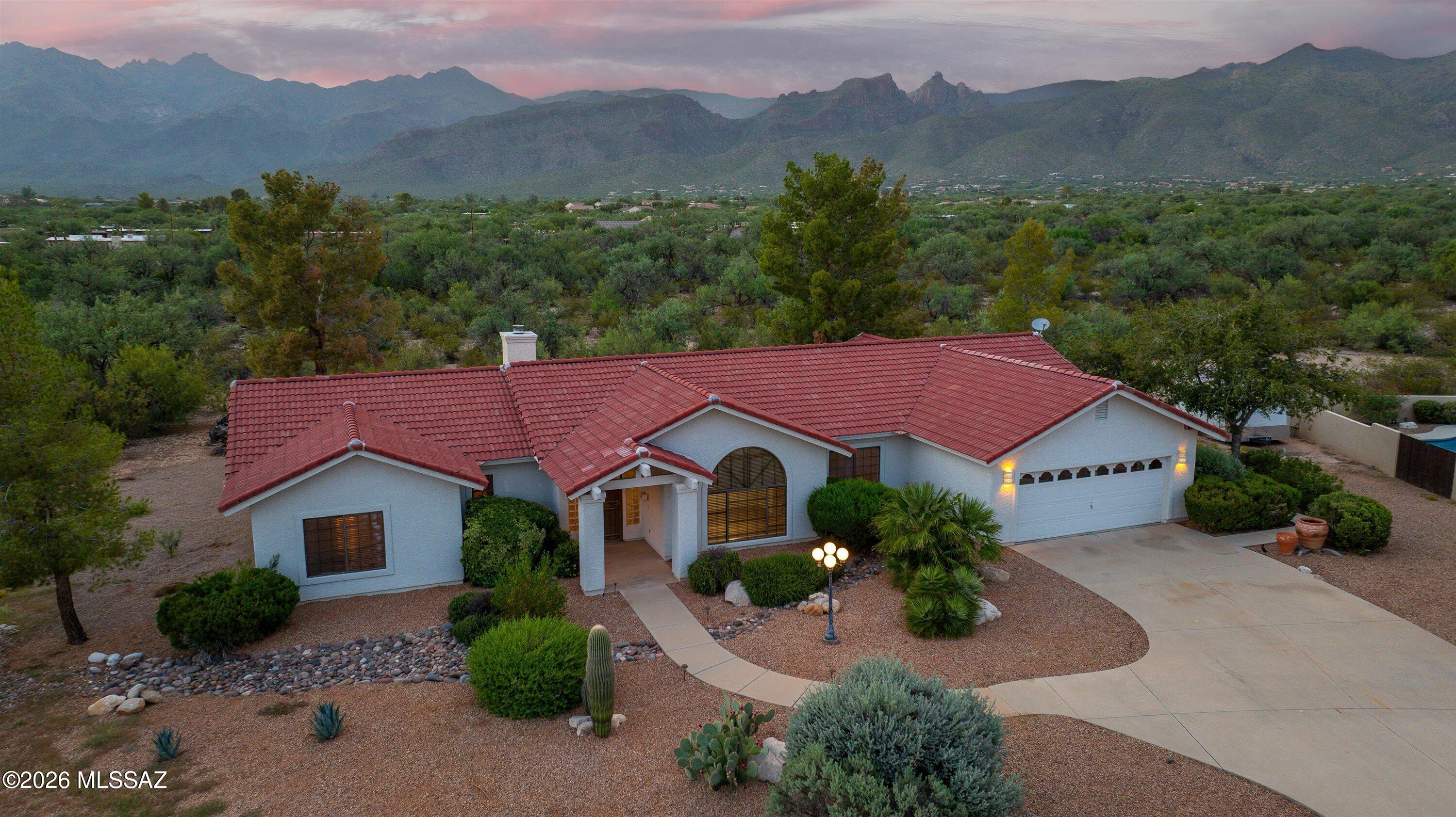 Rare opportunity in desirable Harrison Park Estates! This spacious 4-bedroom, 3-bath home sits on a large .87-acre lot with exceptional panoramic mountain views and a peaceful setting. Inside, enjoy tile and carpet throughout, plus updated kitchen and bathrooms. The backyard is made for enjoying the Arizona lifestyle with a sparkling pool and relaxing jacuzzi, complemented by low-care landscaping. Conveniently located near shopping, dining, McDonald Park and Agua Caliente Park, with easy access to Catalina Highway and Mt. Lemmon. Homes in this quiet NE Tucson neighborhood rarely come available!