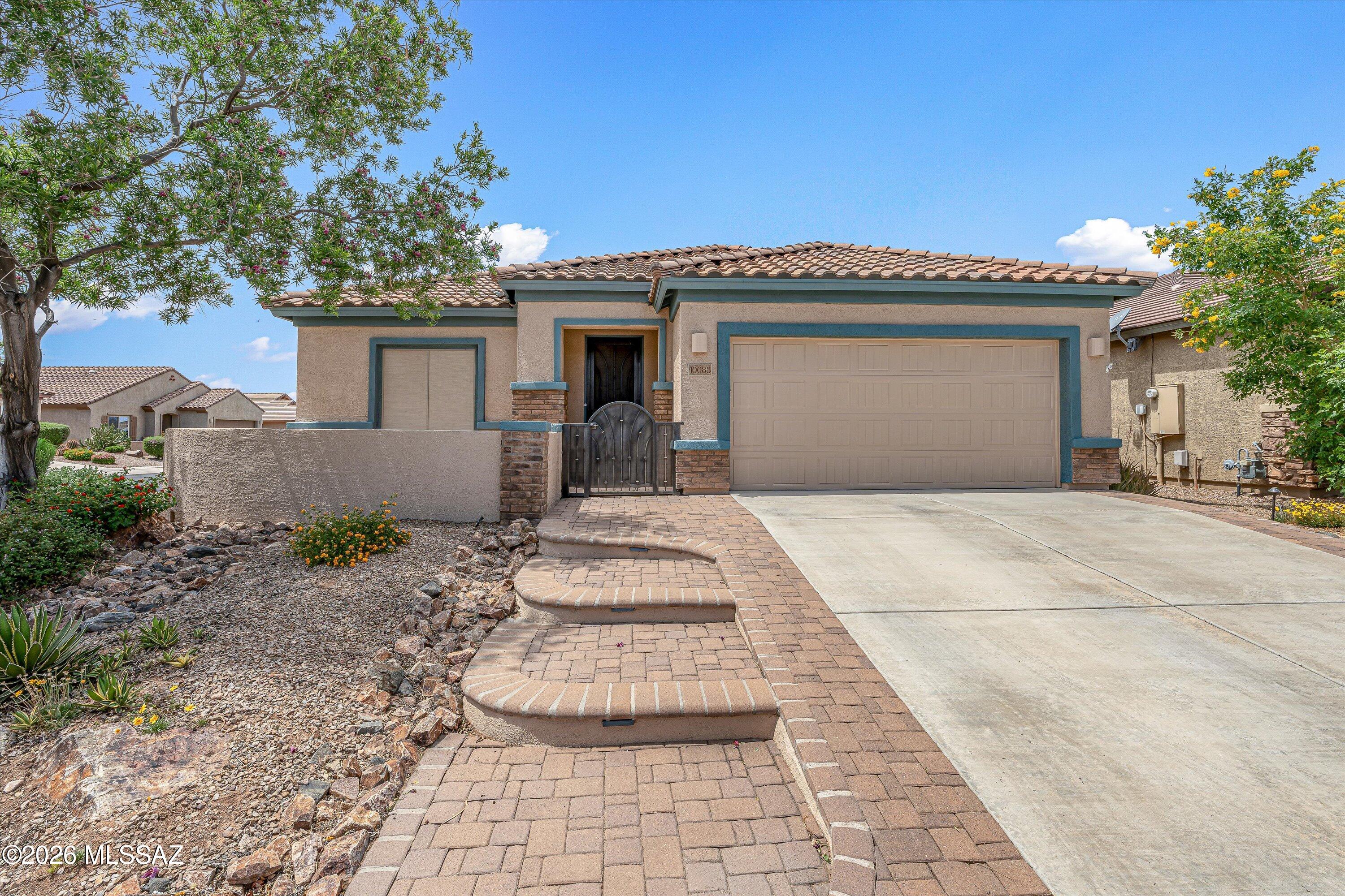Spacious and well-maintained 2 bedroom, 2 bath home with a den, offering 1,981 sq ft on a desirable corner lot. A welcoming courtyard with pavers and a custom security door creates great curb appeal. Inside, you'll find plantation shutters and low-maintenance tile flooring throughout the main living areas. The eat-in kitchen features stainless steel appliances, rich mocha cabinetry, granite countertops, a large center island with seating, tile backsplash, pendant lighting, and a walk-in pantry. The bright living area includes a sliding glass door that opens to the patio, creating an ideal indoor-outdoor flow. The private primary suite offers direct backyard access with its own slider, dual vanities, a spacious custom tiled shower with bench seating, and a generous walk-in closet.