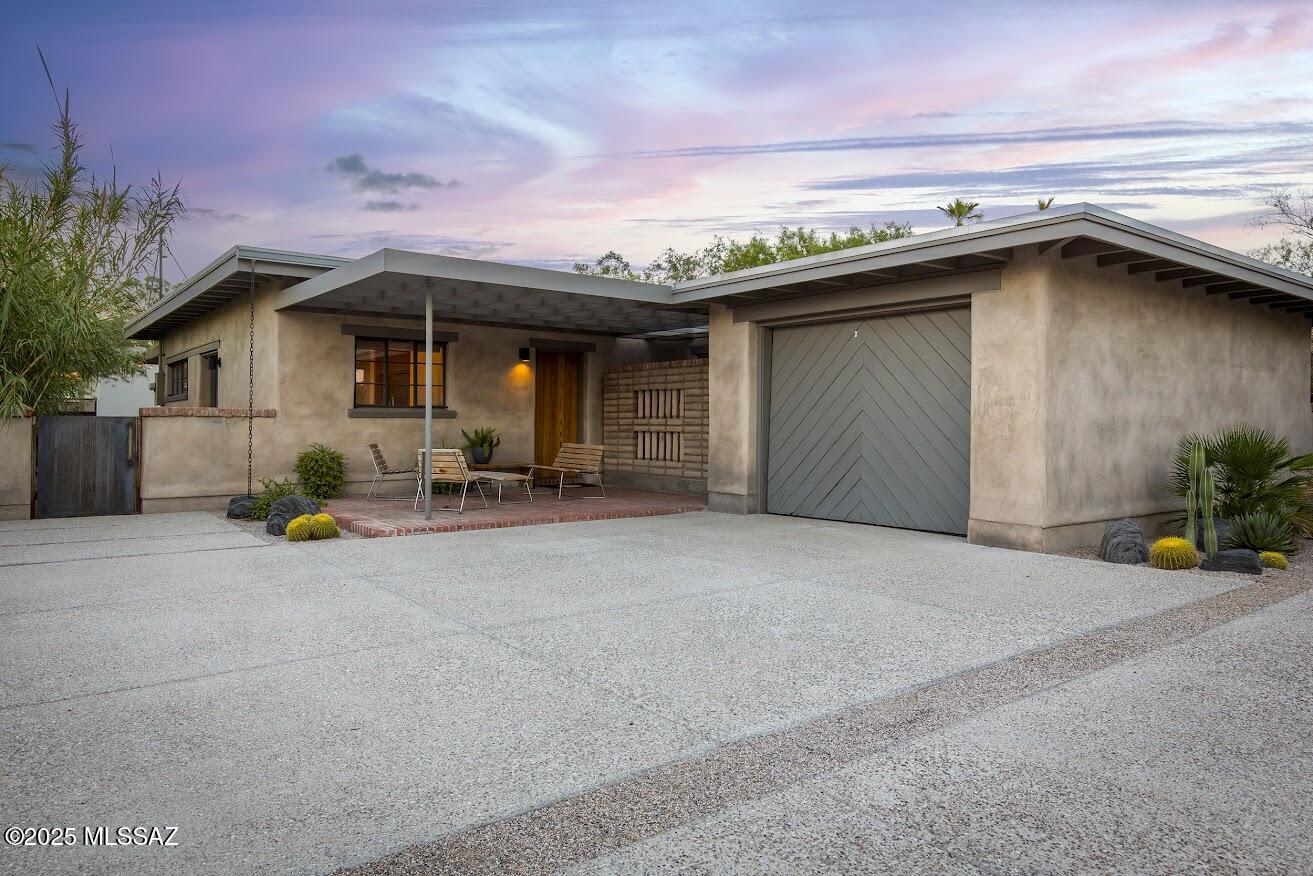 Back on the market! Stunning home that will appeal to architecture lovers, the remodel of this 1952 Josias Joesler, one of his last design projects, is true to the original with exposed adobe, hand-carved beams. Minimalist and modern.  The main home is 2 bd, 2 ba, and the casita can serve as a poolhouse and bath, 3rd bdrm & extra space for your guests. Casita was added in 2022 by previous owners, who remodeled the home with local architects Ha-Ru and builder BaerWorks.  The driveway beyond the casita is ideal for extra parking, your Airstream, as your bike route exit,  through the neighborhood to Natural Grocers, Falora, Session Yoga, Barrio Bread... all that the Joesler-designed village at the corner offers!