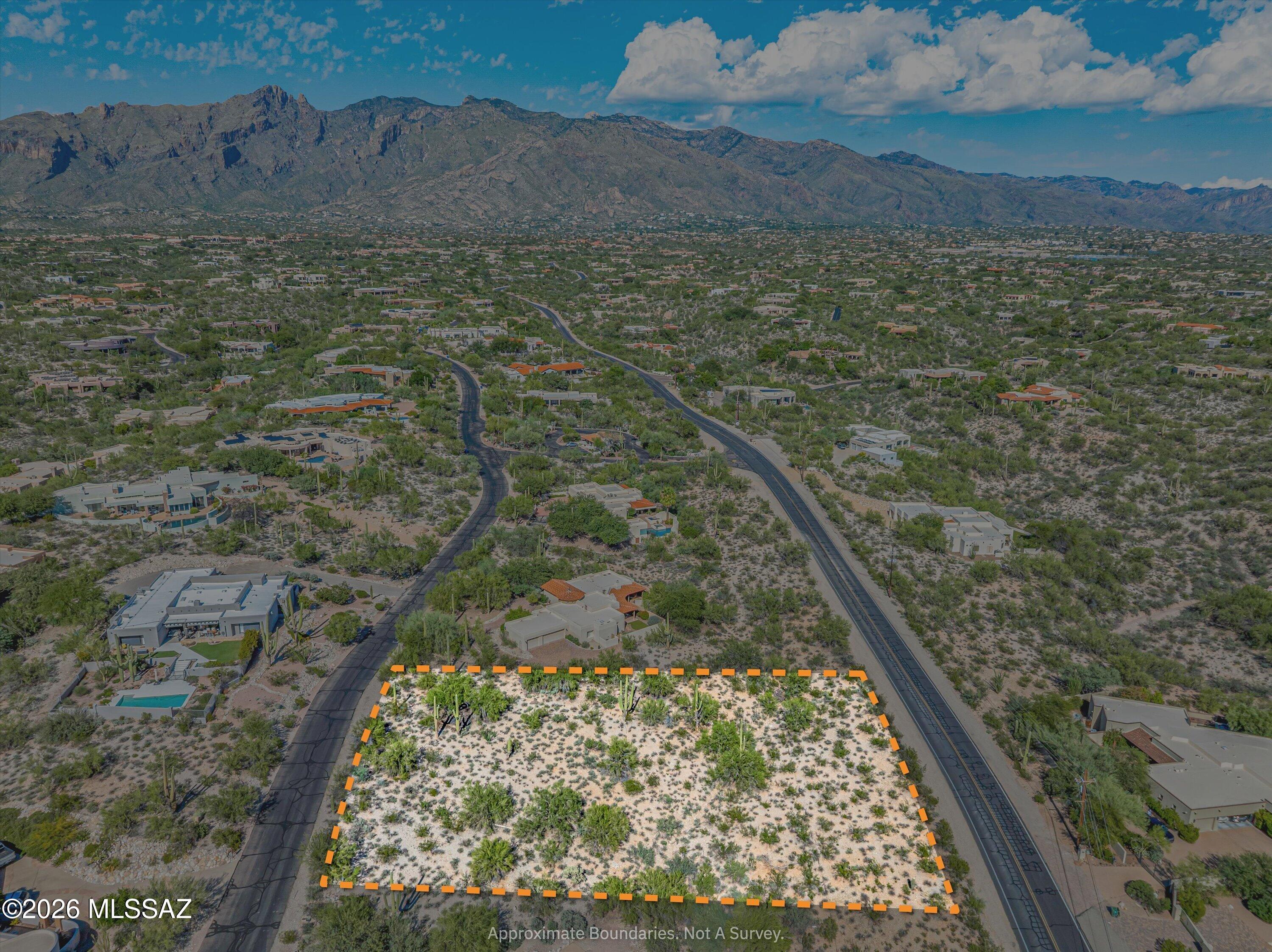 One of the last available lots in beautiful Hacienda Del Sol Estates, a prestigious guard-gated community in the Catalina Foothills. This spacious homesite offers wonderful privacy and security, mature desert vegetation, gorgeous east-facing Catalina Mountain views and city lights to the Southeast bringing plenty of flexibility to design your custom home. Professionally drafted house plans are available to help bring your vision to life. Enjoy the peaceful foothills setting while staying close to excellent dining, shopping, outdoor recreation and the highly regarded Catalina Foothills School District.  Approximately 15 minutes drive to 3 hospitals. A rare opportunity to build something special in one of Tucson's most desirable communities!