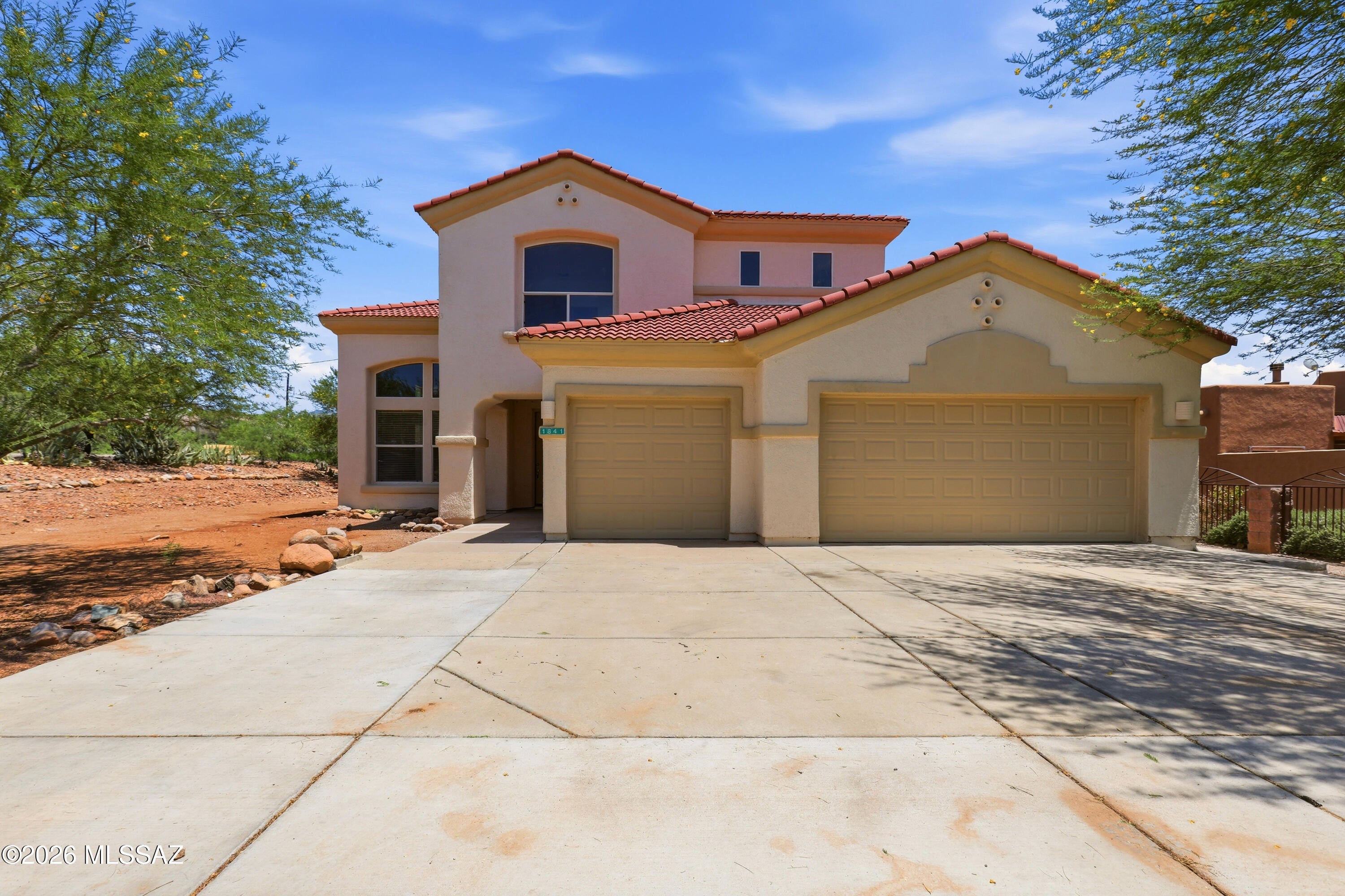 Spacious 4-bedroom, 3-bath home offering approximately 2,594 sq. ft. of comfortable living space on a generously sized lot. This two-story home features an open-concept layout, abundant natural light, a large kitchen, and a versatile downstairs bedroom perfect for guests, a home office, or den. The primary suite includes a private balcony with mountain views, a spa-like bathroom with a soaking tub and walk-in shower, and ample closet space. Enjoy a fenced backyard with no rear neighbors, a covered patio, and a 3-car garage with plenty of storage. A perfect blend of space, comfort, and scenic Rio Rico living.
