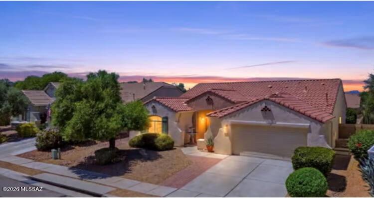 Lovely former model home! Enjoy granite countertops, upgraded cabinets w/pullouts, stainless steel appliances, new carpet & paint, 16-inch tile, skylights, plant shelves, and more. Spacious primary suite with huge walk-in closet. Oversized 2.5 car garage.  Exterior features include easy-care desert landscaping, walled backyard with covered patio, and a Pebble-Tec pool with waterfall spa for year-round enjoyment of this stunning backyard! Truly a must-see.