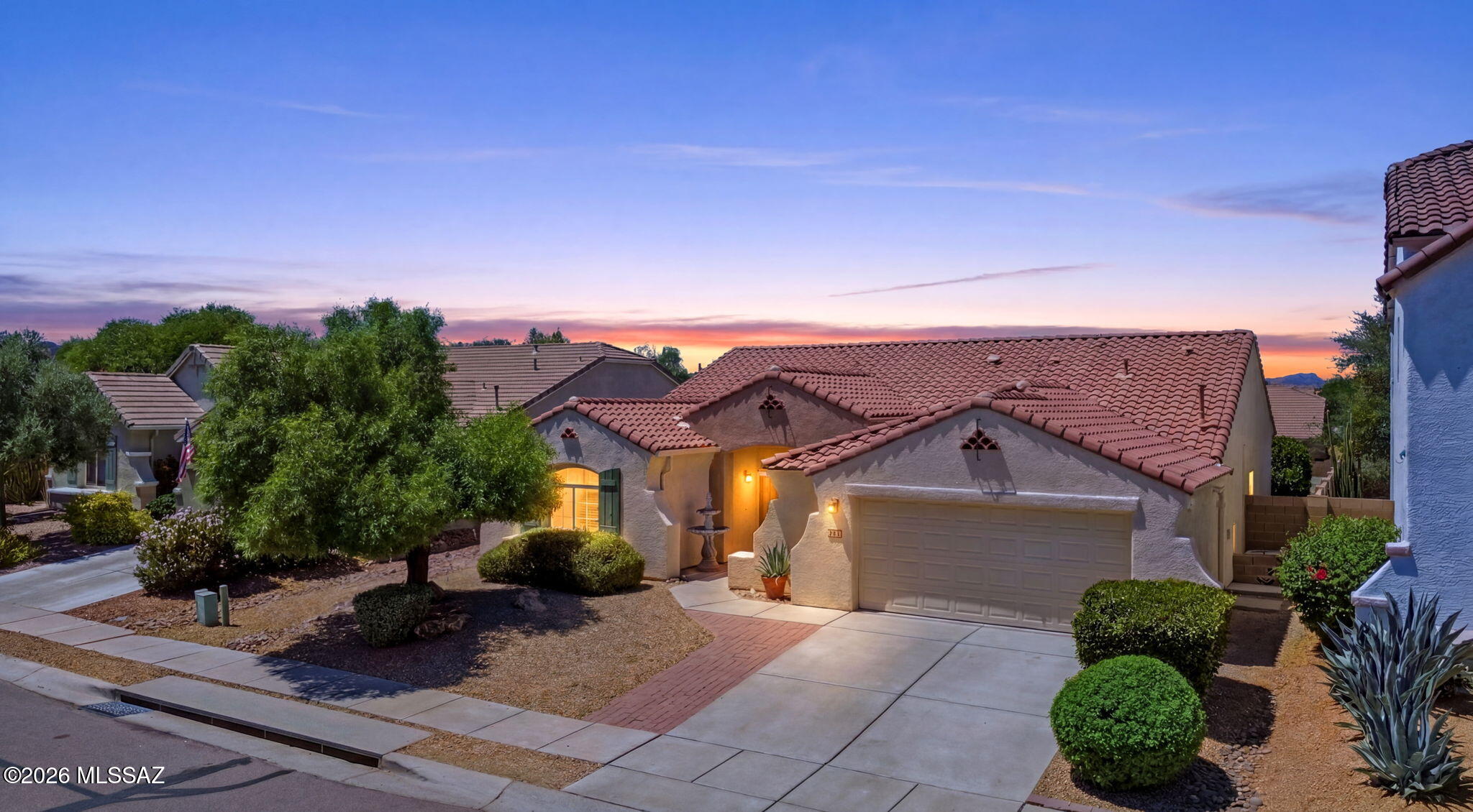 Lovely former model home! Enjoy granite countertops, upgraded cabinets w/pullouts, stainless steel appliances, new carpet & paint, 16-inch tile, skylights, plant shelves, and more. Spacious primary suite with huge walk-in closet. Oversized 2.5 car garage.  Exterior features include easy-care desert landscaping, walled backyard with covered patio, and a Pebble-Tec pool with waterfall spa for year-round enjoyment of this stunning backyard! Truly a must-see.