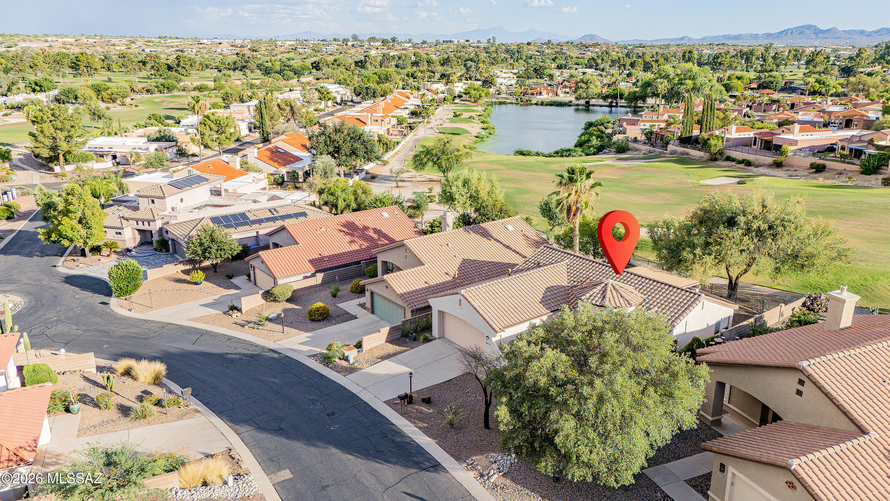 Rare Opportunity on the 15th Fairway of Tucson National's Sonoran Course. This beautifully updated single-family homes captures  sweeping golf course, mountain, and sunset views from one of the community's most desirable neighborhoods.   This 2-bedroom, 2-bath residence offers 1,560 square feet of thoughtfully designed living space with no interior steps.

A grand entry foyer welcomes you into the spacious living area, where expansive windows frame the stunning views beyond. The well-appointed kitchen features soapstone countertops, while soft-close shaker cabinetry provides ample storage. Multiple dining areas, a versatile flex room, and a split-bedroom floor plan provide flexibility for entertaining, working from home, or hosting guests.

Designed for both comfort and outdoor enjoyment, the home features a covered patio, private front courtyard, and oversized two-car garage. The backyard is a true retreat, complete with a putting green, mature landscaping, and unobstructed golf course views.

Extensively remodeled since its last sale, this home offers valuable updates and peace of mind, including a newer roof (October 2024), updated HVAC systems, and complete exterior repainting in 2022.

Ideally located near premier shopping, dining, recreation, and medical facilities, this exceptional property blends comfort, convenience, and scenic beauty. Whether you're searching for a full-time residence or a seasonal retreat, this home delivers the best of resort-style living in one of Northwest Tucson's most sought-after golf course communities.
