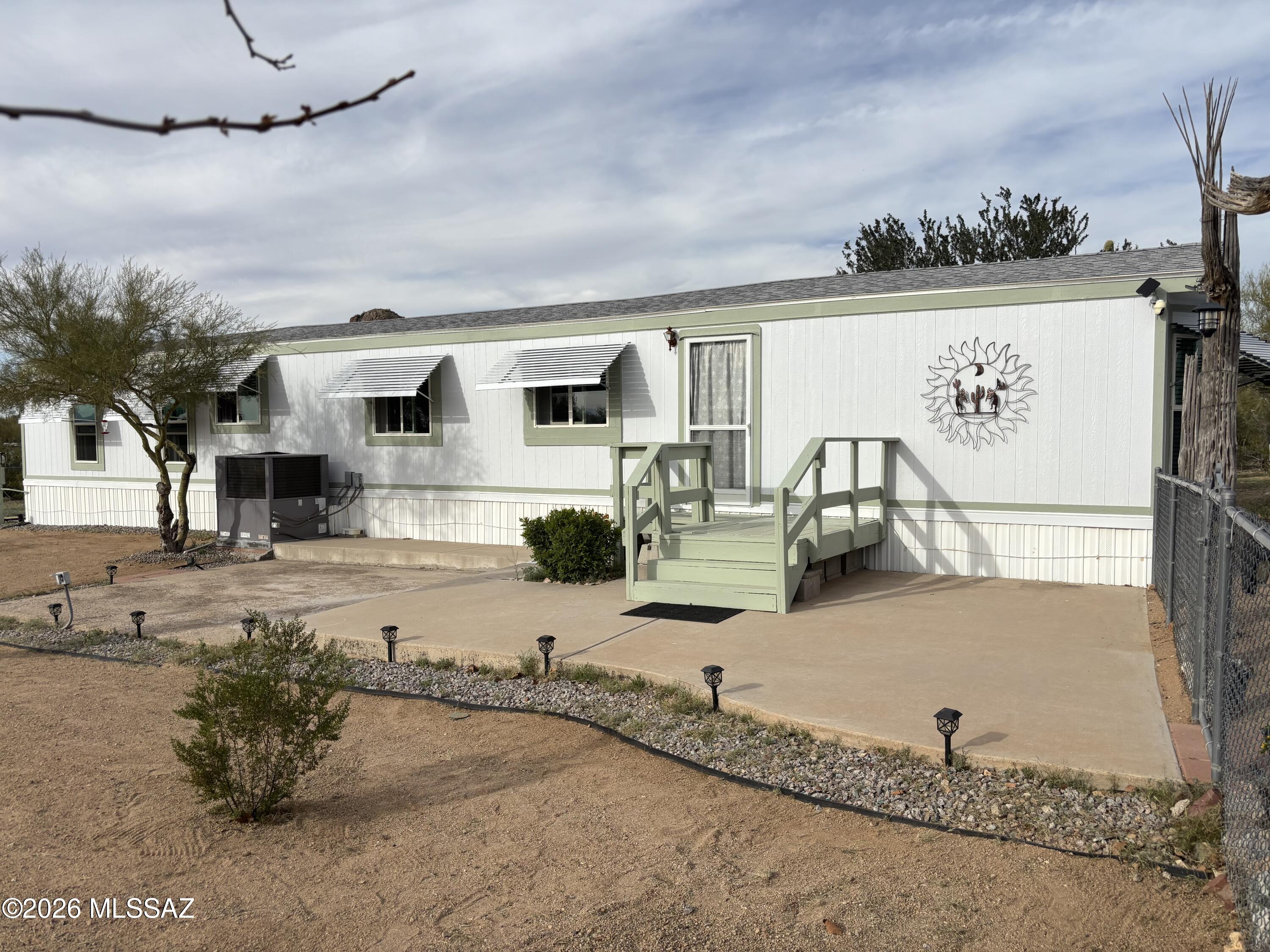 This beautifully updated manufactured home offers a combination of beauty, comfort, privacy and possibilities; the many thoughtful updates make this a home you won't want to miss.  Among the many updates are the fully remodeled kitchen, updated bathrooms, newer roof, heat pump, ductwork, water lines, water heater, flooring, ceiling planks, paint and so much more. Too many updates to mention here so check the documents section for a full list. Plenty of space for an RV and hookups are already in place. Situated on 1 peaceful acre with mountain views all around, this home provides ample room for outdoor living, pets, gardening, recreation and entertaining.  This beautiful home is move-in ready.  Furnishings available, ask for details.
