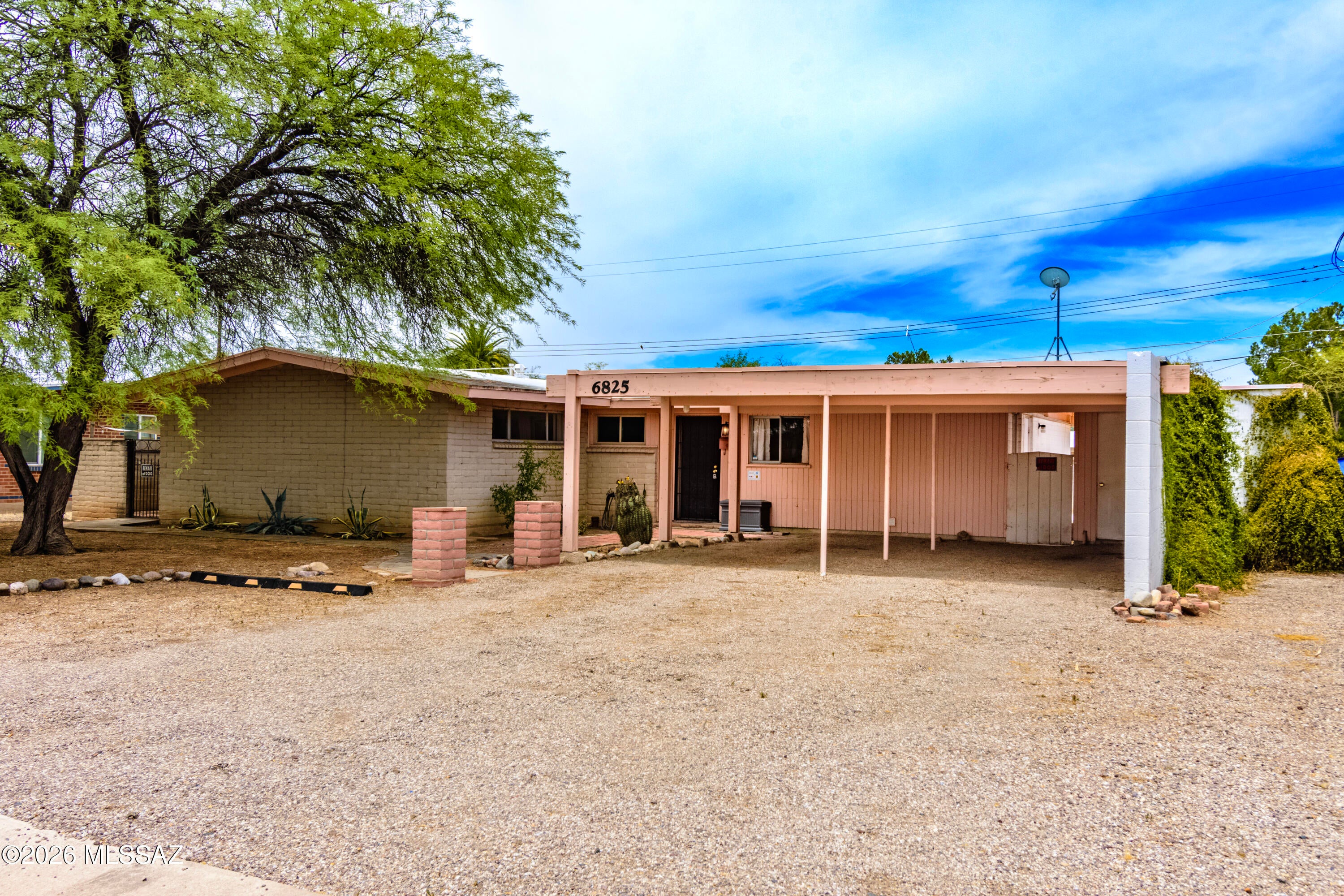 ASSUMABLE VA LOAN OF 2.875% along with price improvements AND NEW UPDATES!! Newly and professionally painted with a fresh, modern color palette throughout. This home features a large front yard with ample parking space, side yard for RV parking and NO HOA. This home has a huge flex room that can be a den, office or even a mother in law suite since it has its own private door and patio from the side of the house. Not only is there a large backyard with a pool but there is also a wood burning fireplace in the living area. Come take a look at this versatile  home that has many bonus rooms, storage areas and prime location for shopping and walking distance to the well known Palo Verde Park.