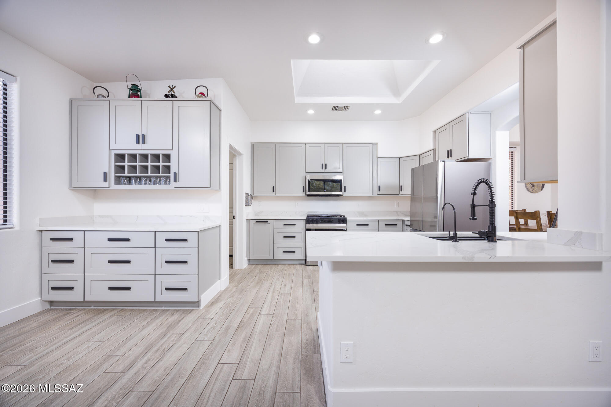 $12,000 Seller Credit for Buyer Closing Costs or Rate-Buy-Down | Gorgeous Renovation | .98 Acre Cul-De-Sac Lot | Exquisite Open Concept | Sparkling Pool & Spa | Sought-After Antler Crest | Multi-Million Dollar Rincon Mountain Views | 3 BED | 2 BATH | 2 Car Extra Deep Garage | Nestled in highly a desired enclave, this light & bright entertainer's retreat has received a stunning renovation. Porcelain plank flooring throughout. Oversized living area, soaring ceilings, kiva fireplace. Expansive kitchen with top-line SS appliances, solid wood cabinetry, quartz counters.  Front courtyard and rear wrap-around dining patios, perfect for gatherings or quiet relaxation near the pool. Deep garage for the car enthusiast or hobbyist. Located minutes from groceries, dining, schools, medical & more.