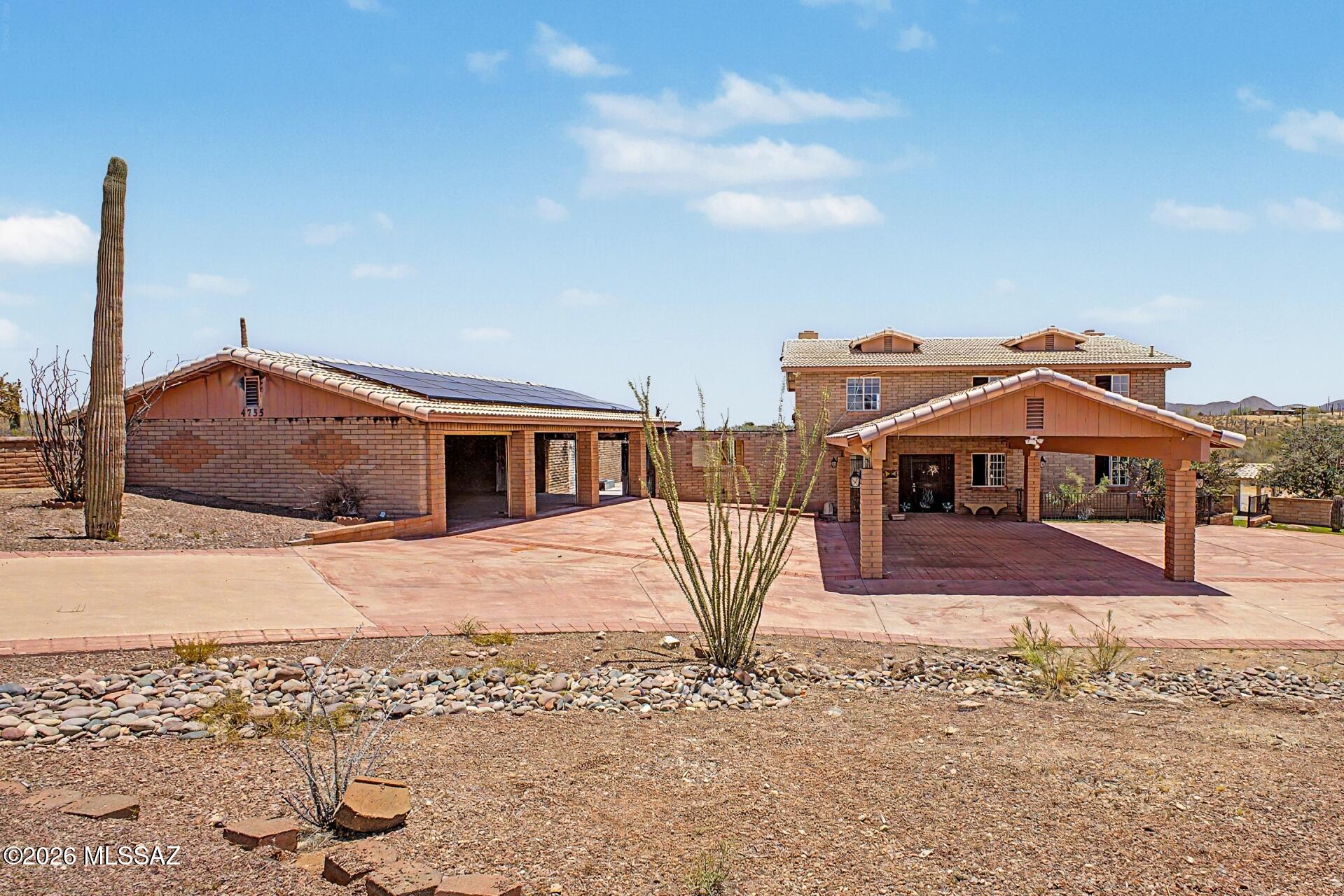 INVESTOR OPPORTUNITY! Fire-damaged fixer-upper on 3.4 acres w/ stunning mountain views in Tucson! This spacious southwestern brick home features an expansive red circular drive w/ RV parking, a brick porte-cochère, a detached multi-car carport, & solar panels. Inside, enjoy large living areas, a cozy fireplace, & an upstairs primary suite w/a fireplace, ensuite, & private view balcony. The sprawling backyard is anchored by a swimming pool & a unique sunken seating area. Short term Seller financing available w/ 10% down.  Financing for renovations is also available. Contact listing agent for terms. This property is being sold As Is. Seller will do no repairs. Buyer to turn on utilities at their own expense should they wish to have them on for inspections. Great Opportunity! Agent/Owner.