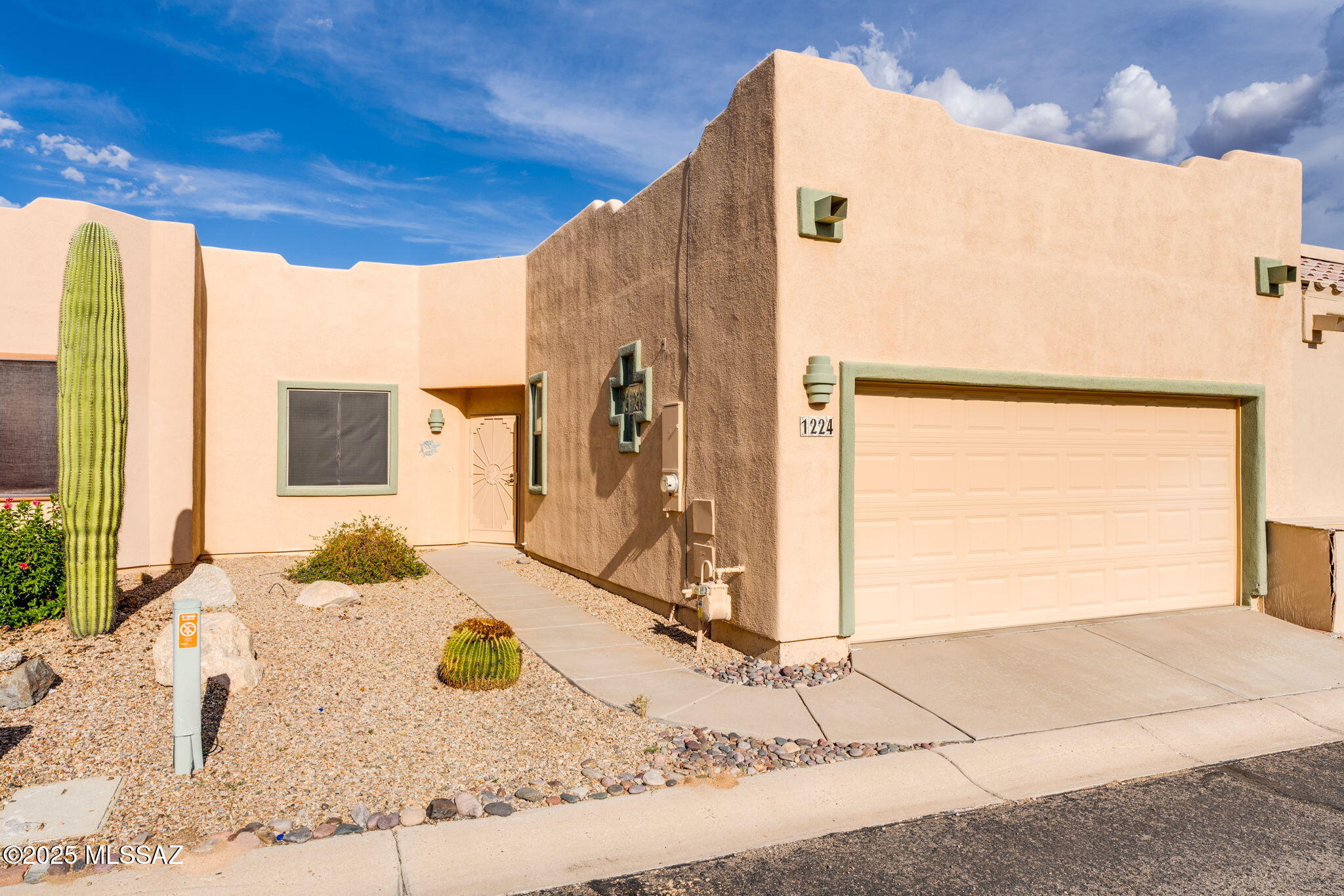 Welcome to 1224 N. Laramie Ln, located in Canyon View Estates. This charming 2-bedroom 2-Bathroom townhome offers 1,168sqft of comfortable living with a bright, inviting feel. Inside, you will find ceramic tile in the main living areas that complement the cozy carpet in the bedrooms. Recessed lights throughout and Skylights that fill the home with natural light. The kitchen features a spacious pantry closet and opens to a sunny breakfast nook, with an additional dining area off the kitchen perfect for hosting with family and friends. Step outside to a large sized back yard with no rear neighbors, offering added privacy and plenty of space to add your personal touch, entertain, and simply unwind. Enjoy the peaceful Arizona sunrise from your living room or out on the patio. Residents of Canyon View Estates enjoy access to a well-appointed clubhouse with a kitchen multipurpose room with TV, books, and puzzles, a fitness area, shuffleboard, and a saltwater pool heated year-round, along with a relaxing hot tub. Green Valley Recreation (GVR) membership is available but not required. Whether you enjoy an active, social lifestyle or prefer a more private setting, this home offers the perfect balance. Come experience all it has to offer.
