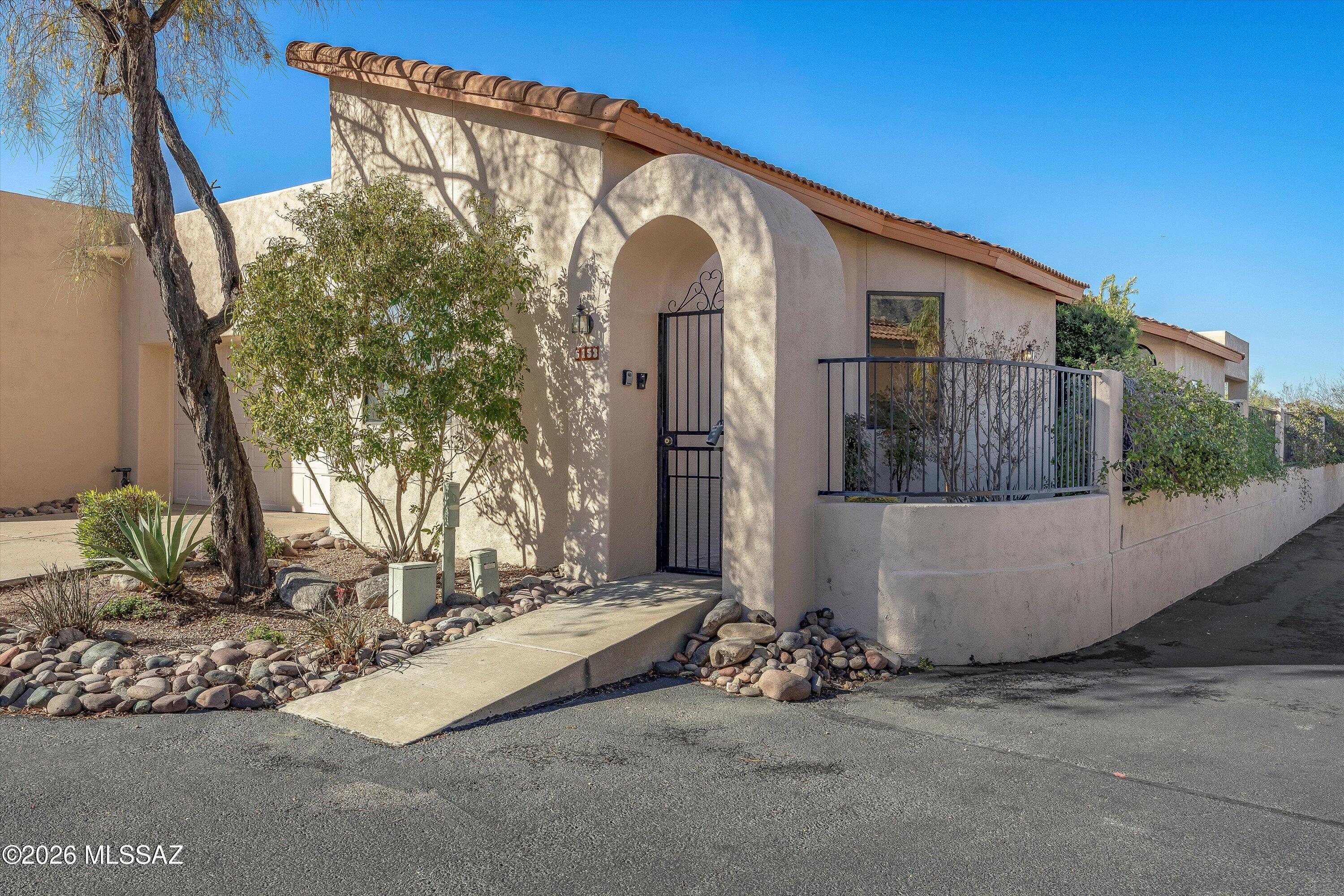 Welcome to effortless living in the Catalina Foothills! This 2BR+Large Den patio home is nestled within the popular gated community of Kachina Hills. A split bedroom plan offers the perfect blend of privacy and luxury.
The heart of the home features a bright and airy kitchen with a charming breakfast area, where you can enjoy your morning coffee while taking in the Catalina mountain view. The spacious living and dining areas provide an elegant setting for entertaining, while the large den complete with a double pocket door offers the versatility for a home office, media room, or hobby space. The thoughtful layout ensures maximum privacy for the primary suite and the secondary bedroom. Step outside to your private back patio to soak in the serene desert landscape & mountain views. With its low-maintenance lifestyle and secure gated setting, this home is a rare find. Enjoy the community pool, spa, and two gates for easy access to Swan Road and Pontatoc Road. The primary bathroom has been updated with modern finishes, a tiled shower, dual vanities, and a walk-in second closet. The washer, dryer, refrigerator, and all concrete planters are included in the sale. Some items that remain in the home can be included in the sale (original artwork in the dining room and above the fireplace, and some staging items are not included in the sale).