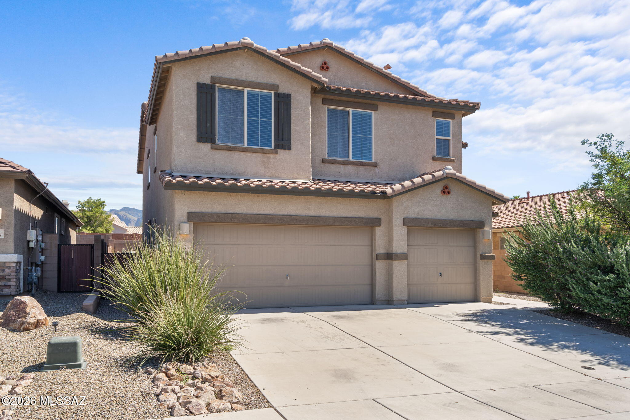 BEAUTIFUL home  with loads of SPACE!  Tile floors on the ground level, other than the open den/flex space, walk in closet and under stairs closet! Wide open with soaring ceilings and decorator touches. The spacious kitchen features quartz countertops, HUGE island, plentiful cabinet space as well as stainless steel appliances. This opens right up into your great room. Upstairs you will find 4 bedrooms, and three bathrooms. Two of the bathrooms feature their own bathroom. The owners suite has one of the LARGEST showers with two shower heads, a dual vanity and the closet is humongous. Laundry room (washer and dryer included) with plenty of space for shelving or laundry baskets. Private backyard with covered patio and decorative rock. Three car garage. Tenant occupied until 7/31/26