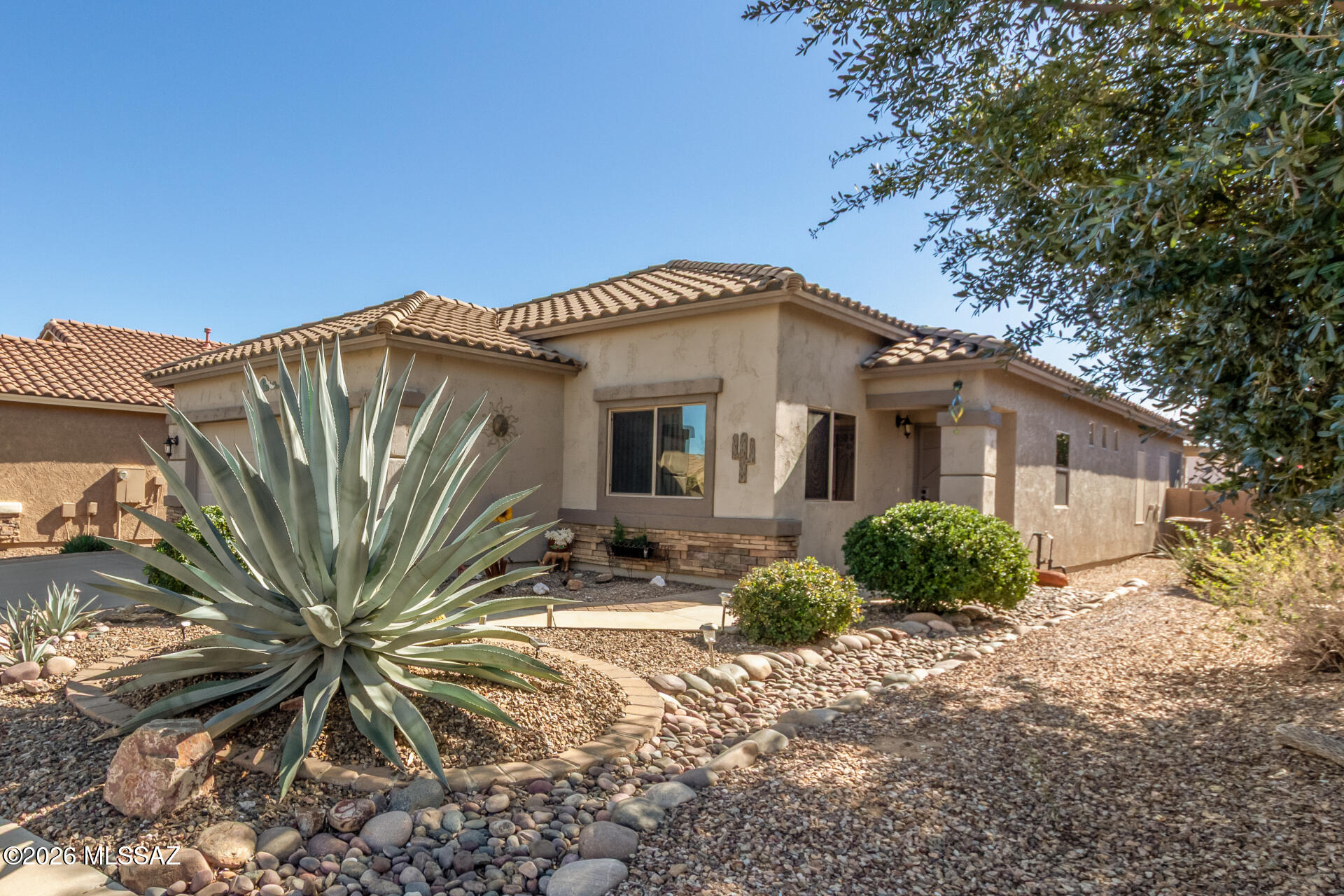 Experience the pinnacle of 55+ active adult community living in this stunning, single-level sanctuary located in Sahuarita's Rancho Resort. This turn-key ready residence, one of the community's largest floor plans, offers a spacious 1,800 sq. ft. layout featuring 2 bedrooms, 2 baths, plus a versatile den/flex-space perfect for hobbies or activities.

Inside, the home boasts a design made for effortless comfort, including door levers for accessibility and a bright interior illuminated by skylights and solar tubes. The kitchen is a standout, featuring a kitchen island, stainless steel refrigerator, and a convenient breakfast nook.

Embrace the ''lock-and-leave'' peace of mind provided by a gated community and low-maintenance landscaping. Step outside to your private oasis featuring a covered patio with, a cozy beehive fireplace, and a soothing fountain.

Living here means access to world-class resort-style amenities: a clubhouse, pickleball courts, a heated pool, spa, and a ballroom with a vibrant social calendar. With proximity to the Santa Rita mountains, local dining, and easy I-19 access, this isn't just a home, it's your best chapter yet.