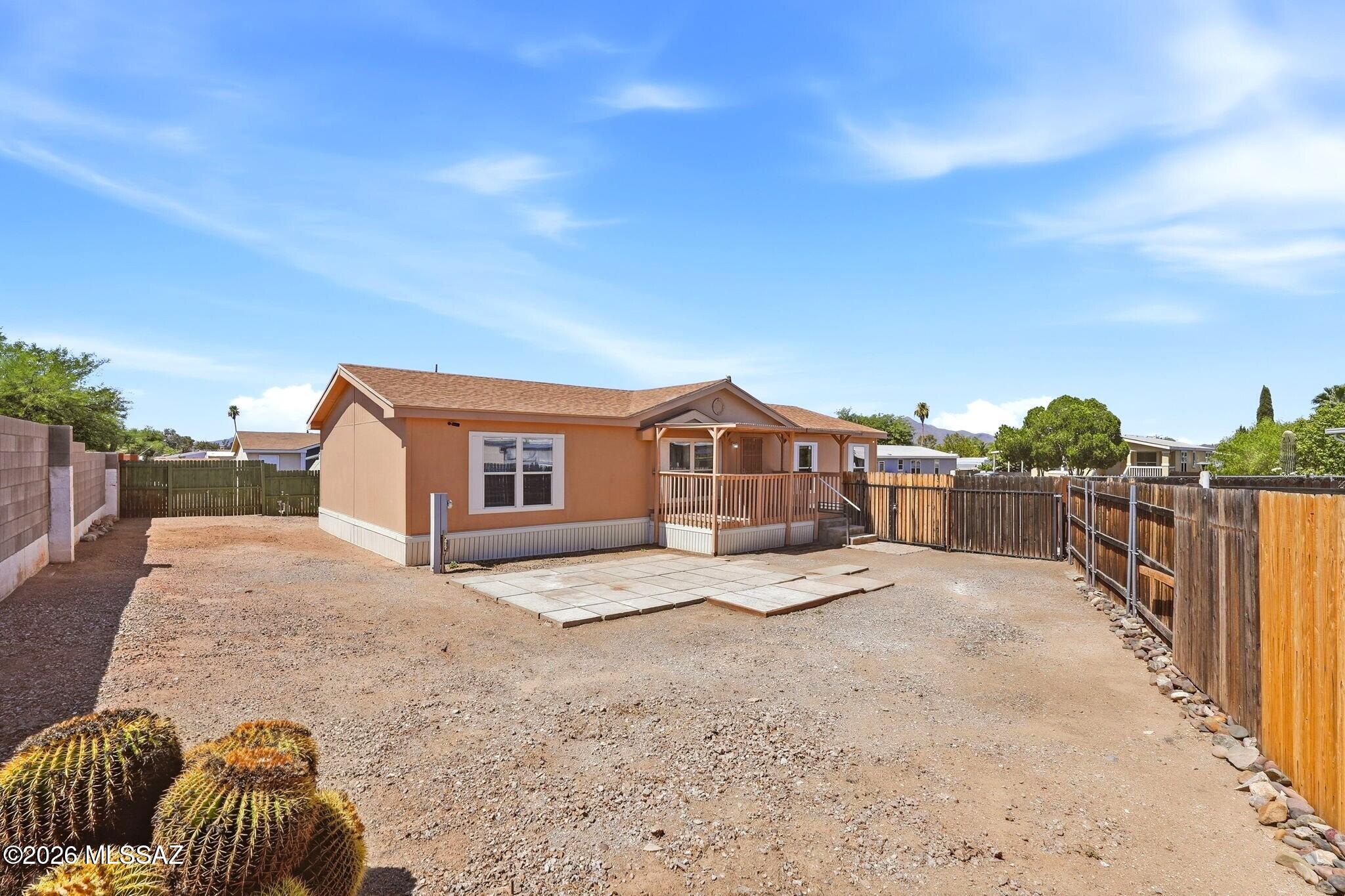 No need to look any further! Just unpack & relax in your completely remodeled home with fully fenced backyard. Large kitchen boasts all stainless-steel appliances, island & pantry closet! Huge primary bath features plenty of countertop space & separate vanity area with cabinetry for storage. Two separate closets in the primary bedroom too! Brand-new AC heat pump is ready to keep you cool this summer. Unwind each evening from your covered front porch, watching the beautiful desert sunsets. Tall fence & wooden door open to your spacious backyard that's fully fenced for extra privacy. New roof has transferable warranty through the end of Nov. 2030. Enjoy access to the community pool, spa, clubhouse, playground & full basketball court in this well-maintained community with no age restrictions.