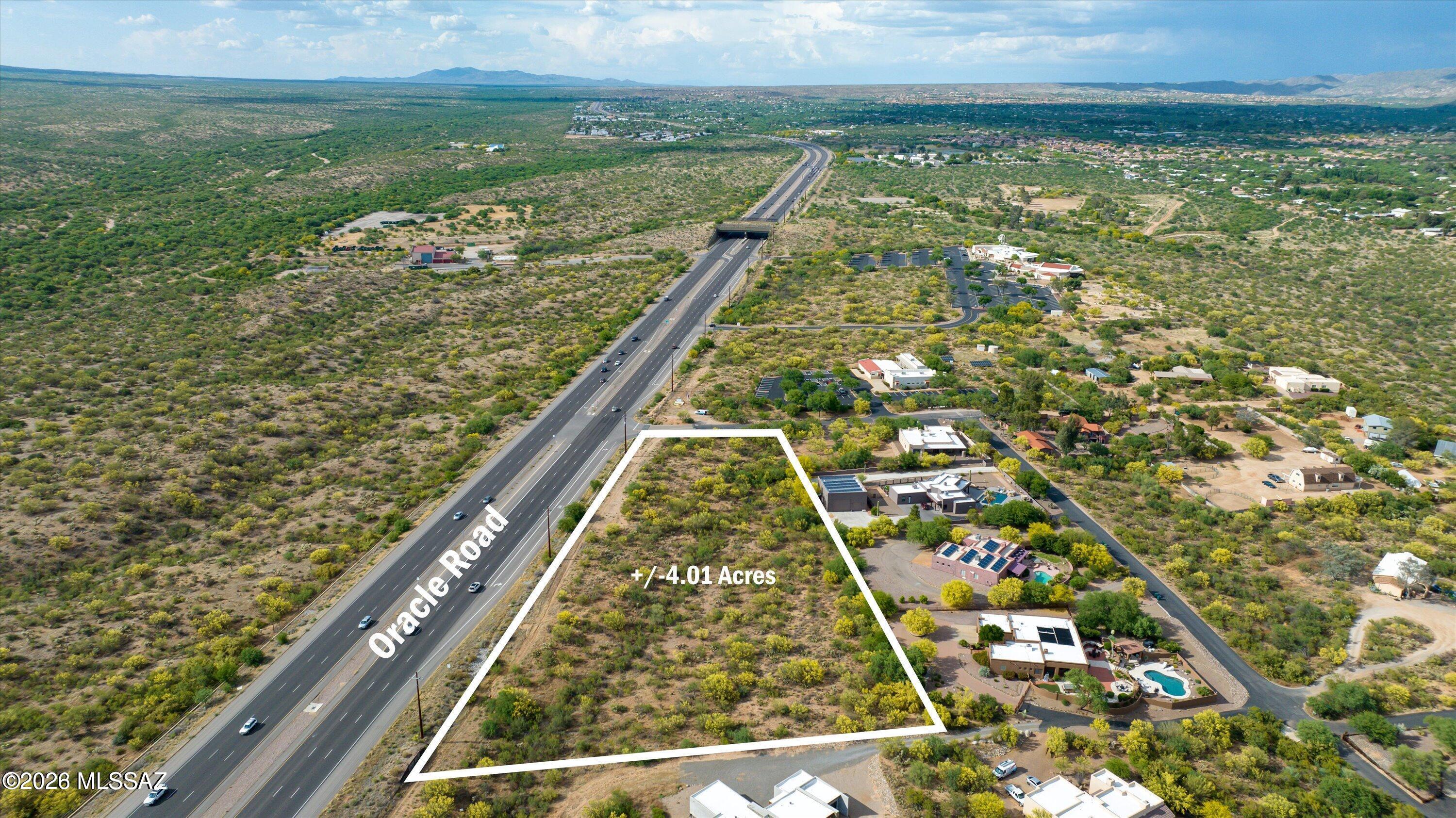 Exceptional development opportunity! This 4-acre commercial parcel boasts prime Oracle Road frontage at the SE corner of Oracle Road and Mountainaire Drive. Perfectly positioned between Oro Valley and Catalina, this versatile transitional-zone property is ripe for development. Flexible zoning allows for high-density residential, rental housing, medical/professional offices, assisted living, daycare, or retail. Enjoy excellent accessibility with paved roads and an established turn lane. Buyer to verify utilities.