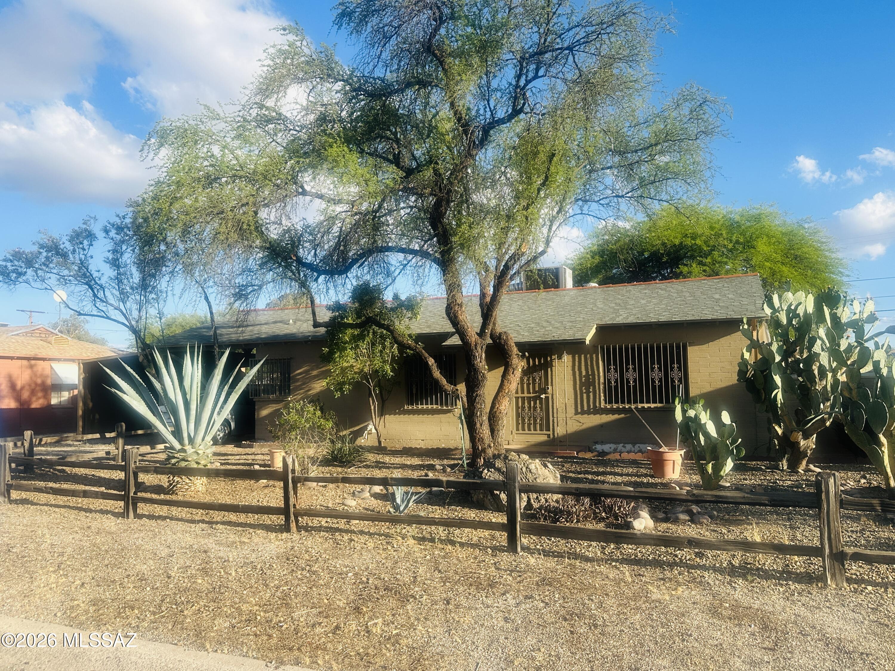 Welcome to This Charming 2 Bedroom, 1 Bath Home Featuring a Bright and Spacious Living Room with Plenty of Natural Light, 1950's Retro Mint Tile Counters & Updated Stainless Steel Appliances in the Kitchen, Plenty of Parking, and Views of the Catalinas to the North! Ceramic Tile in Kitchen & Bath-Just Needs New Carpet. This Home Offers Comfort, Style, and Convenience Complimented by a Functional Layout that Makes Everyday Living Easy. 

Step Outside to Your Own Desert Oasis and Enjoy the Spacious Yard Ideal for Relaxing, Gardening, or Weekend Gatherings. Plenty of Shade from the Mature Trees, the Covered Patio and Ramada. 

Whether You're a First-Time Buyer, Downsizing, or Looking for an Investment Opportunity, This Home Checks All the Boxes!