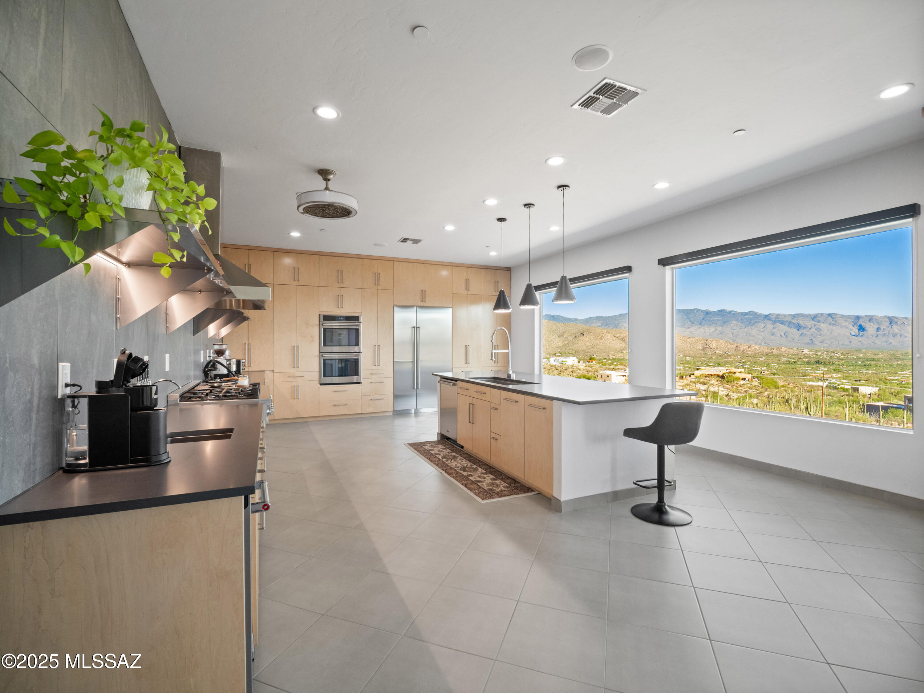 Not many homes come on the market in Milagrosa Hills. This Italian-inspired 2023 estate is a rare fusion of refined elegance and modern sustainability. Nestled on 5.62 pristine acres, the residence offers sweeping, unobstructed views of Tucson's twinkling city lights and majestic mountain backdrops.
With 5 spacious bedrooms and 5 bathrooms, this thoughtfully designed home provides a retreat for both comfort and privacy. The heart of the home is a chef's kitchen framed by massive picture windows, bringing the Sonoran Desert's beauty indoors. Every space is a statement of timeless sophistication.
The estate also boasts a 3-car garage, an owned solar energy system, and a seamless indoor-outdoor flow ideal for entertaining or tranquil evenings under the stars. See list of features. See attached renderings for pool and landscaping.