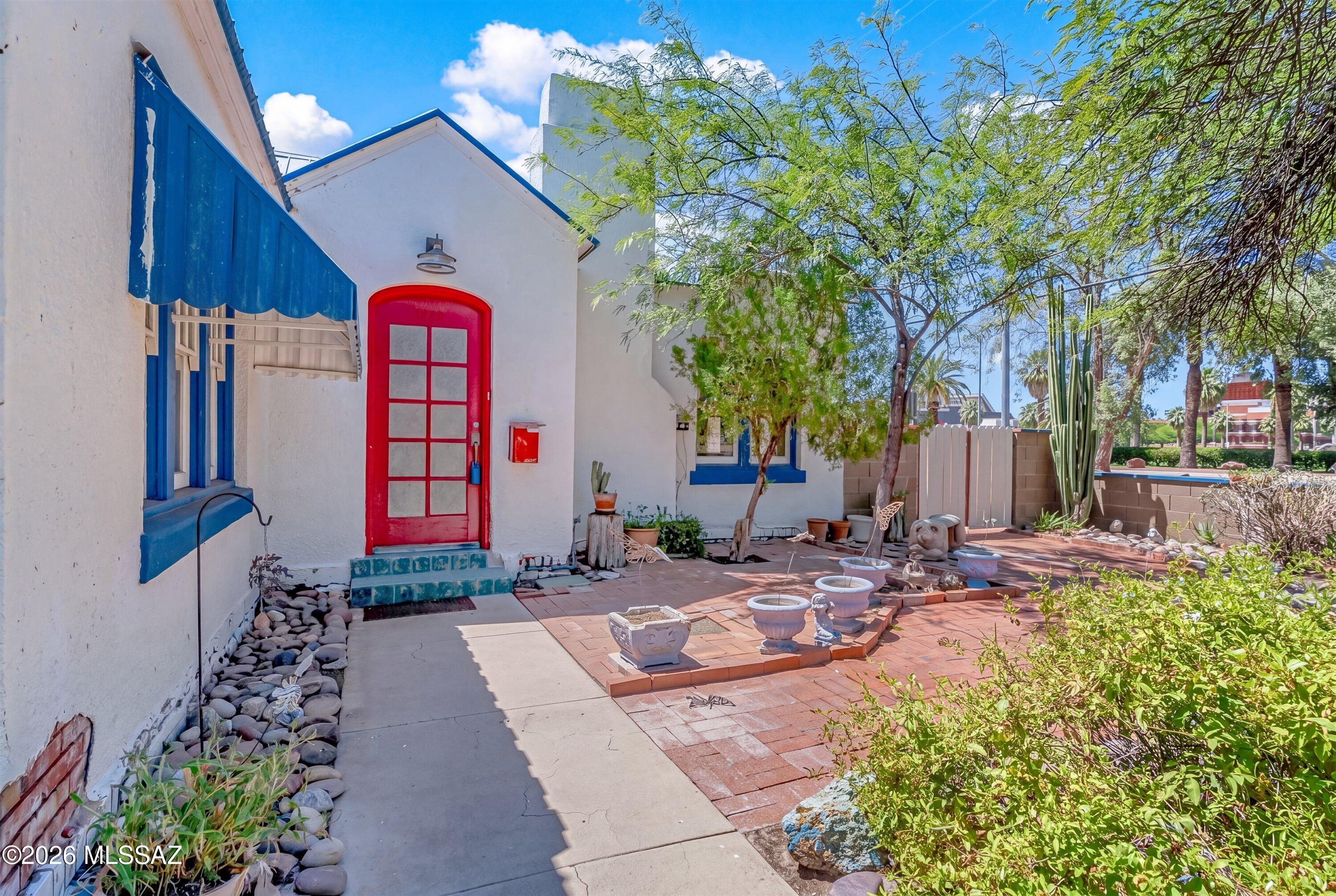 Beautifully remodeled 5-bedroom, 3-bath home in Tucson's coveted Sam Hughes neighborhood, directly across from the University of Arizona. Situated on a large corner lot with several mature shade trees. A separate casita with private parking adds flexibility for guests, a private office, or rental income. Thoughtfully updated with restored red oak hardwood floors, remodeled bathrooms, a new HVAC system, fresh interior and exterior paint, and a new Arizona room perfect for relaxing or entertaining. Enjoy an exceptional location steps from the University of Arizona, with the added benefit of a remarkably quiet interior created by the home's solid double-brick construction. Don't miss this dream to own a prime home in Tucson's Historic Sam Hughes neighborhood.