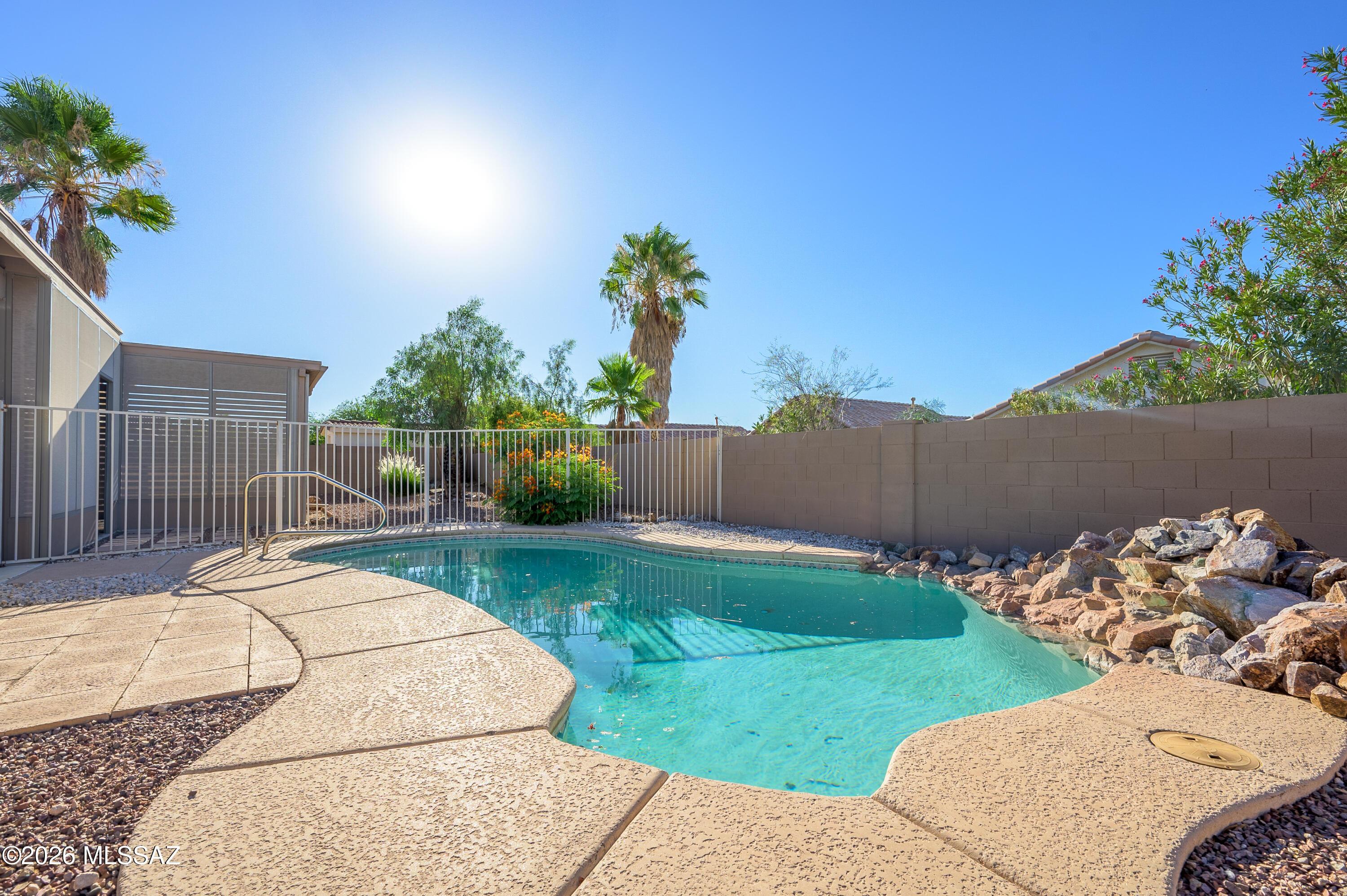 Welcome home to this open concept family home in growing Rita Ranch. From the first steps you'll see the freshly painted exterior, 3 car garage with cabinets and welcoming entrance. Inside enjoy the move in ready feel with a well maintained clean home ready for it's new owners. Open concept living and dining room centered around the kitchen makes a perfect entertaining spot. The backyard features a screened in porch and sparkling pool with low care landscaping.