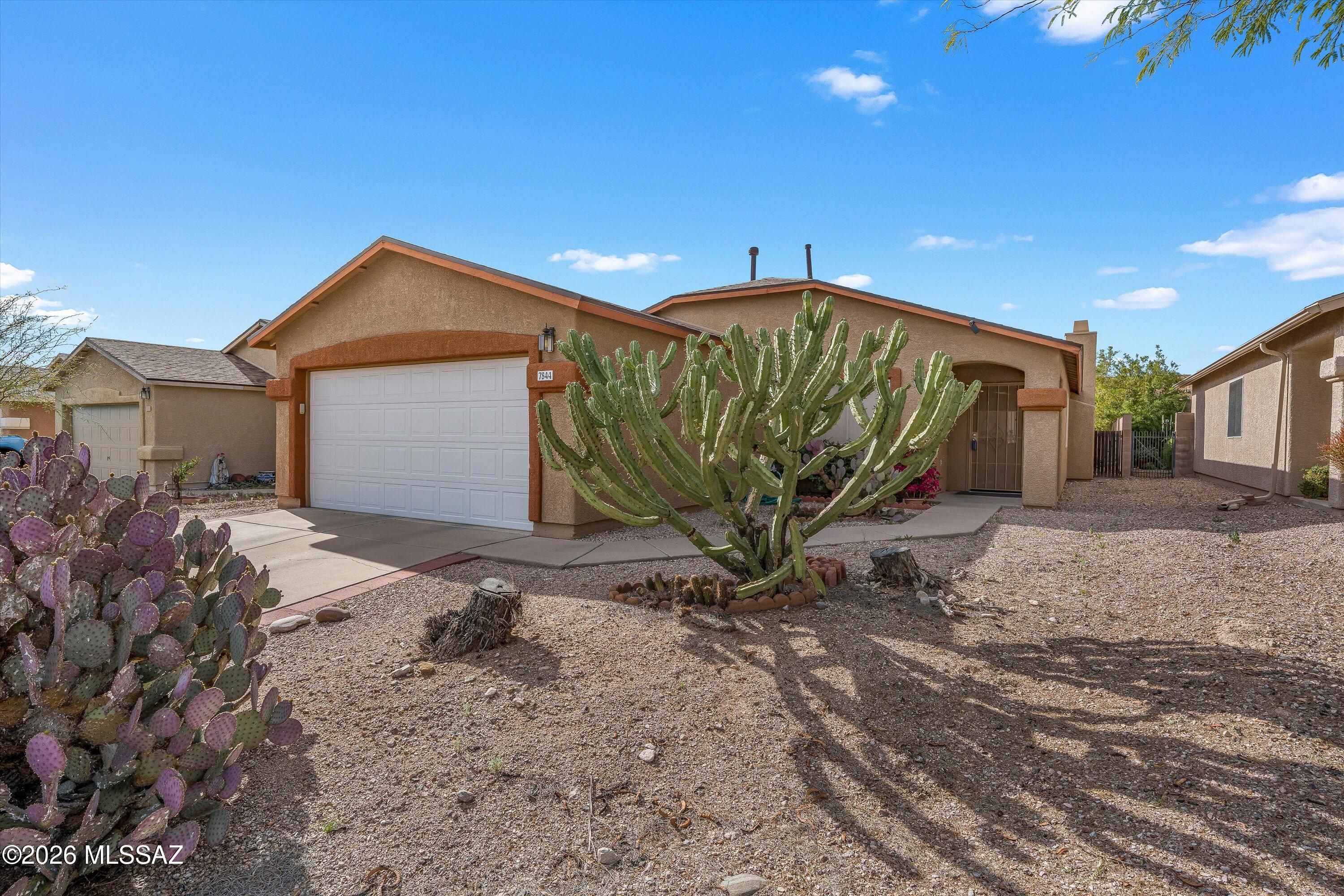 Discover this inviting Rita Ranch residence in a peaceful cul-de-sac with no HOA under 300k. Gently lived-in and well cared for, this home offers 3 bedrooms and 2 bathrooms, an open, light-filled layout, and recent updates including new exterior paint and roof for added peace of mind. Enjoy nearby neighborhood park space and schools, great for families and outdoor time. The home has an assumable solar lease with a reputable provider SunRun, helping reduce monthly electric costs. Conveniently located close to shopping, dining, easy highway access for commuters, and near several military bases, this home is ideal for military families. Comfortable, move-in-ready Arizona living in a friendly community -- schedule a Showing today!