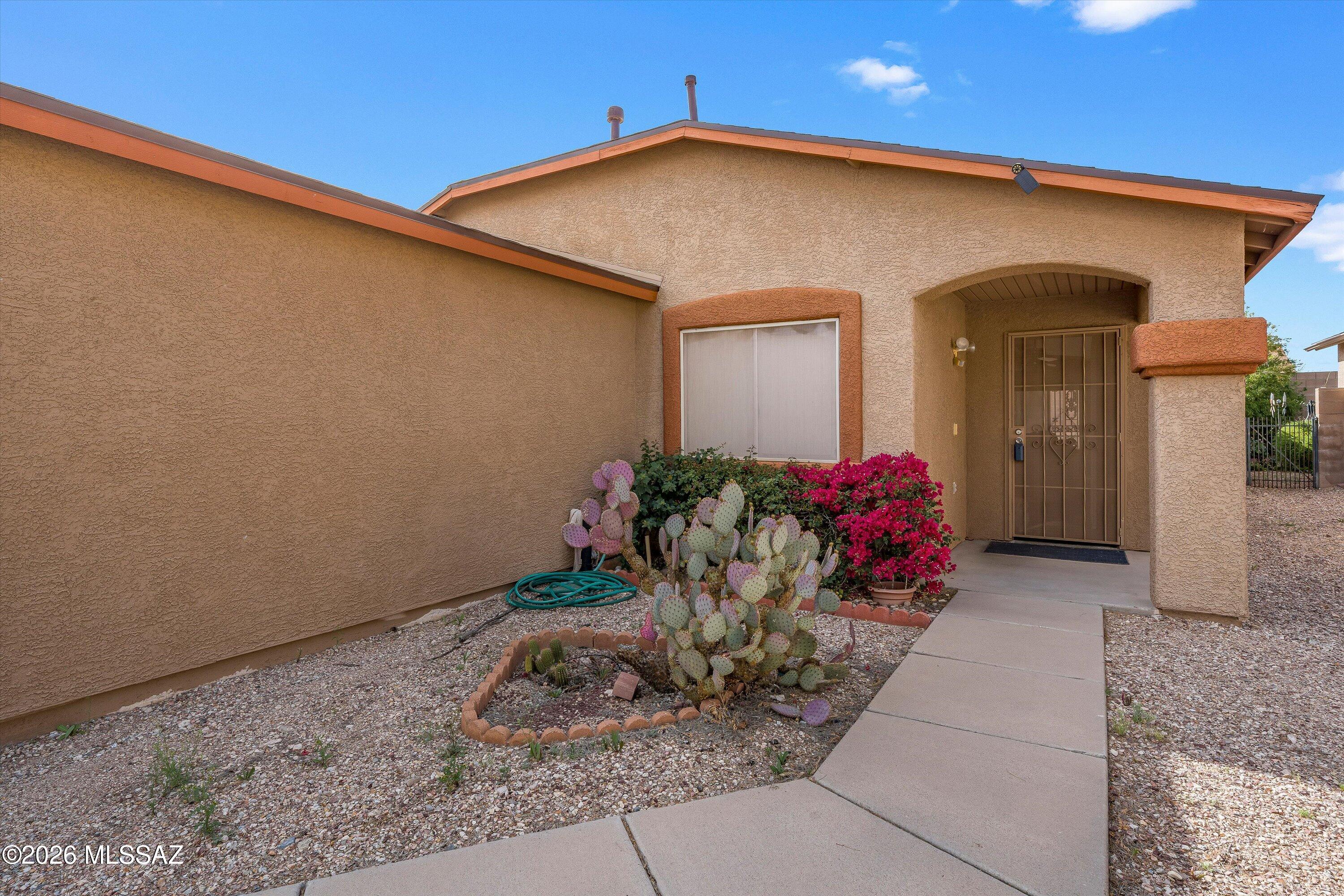 Discover this inviting Rita Ranch residence in a peaceful cul-de-sac with no HOA under 300k. Gently lived-in and well cared for, this home offers 3 bedrooms and 2 bathrooms, an open, light-filled layout, and recent updates including new exterior paint and roof for added peace of mind. Enjoy nearby neighborhood park space and schools, great for families and outdoor time. The home has an assumable solar lease with a reputable provider SunRun, helping reduce monthly electric costs. Conveniently located close to shopping, dining, easy highway access for commuters, and near several military bases, this home is ideal for military families. Comfortable, move-in-ready Arizona living in a friendly community -- schedule a Showing today!